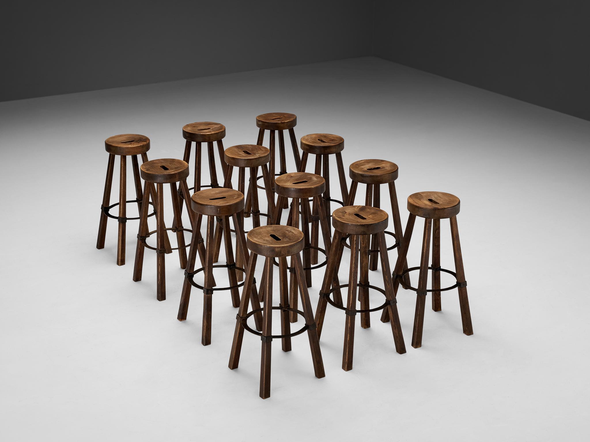 Brutalist bar stools, wood, steel, Europe, 1970s

Exquisite and robust, these bar stools showcases a striking patina that is characteristic of the brutalist design prevalent in the 1970s. With a seat carved out, they effortlessly merge form with