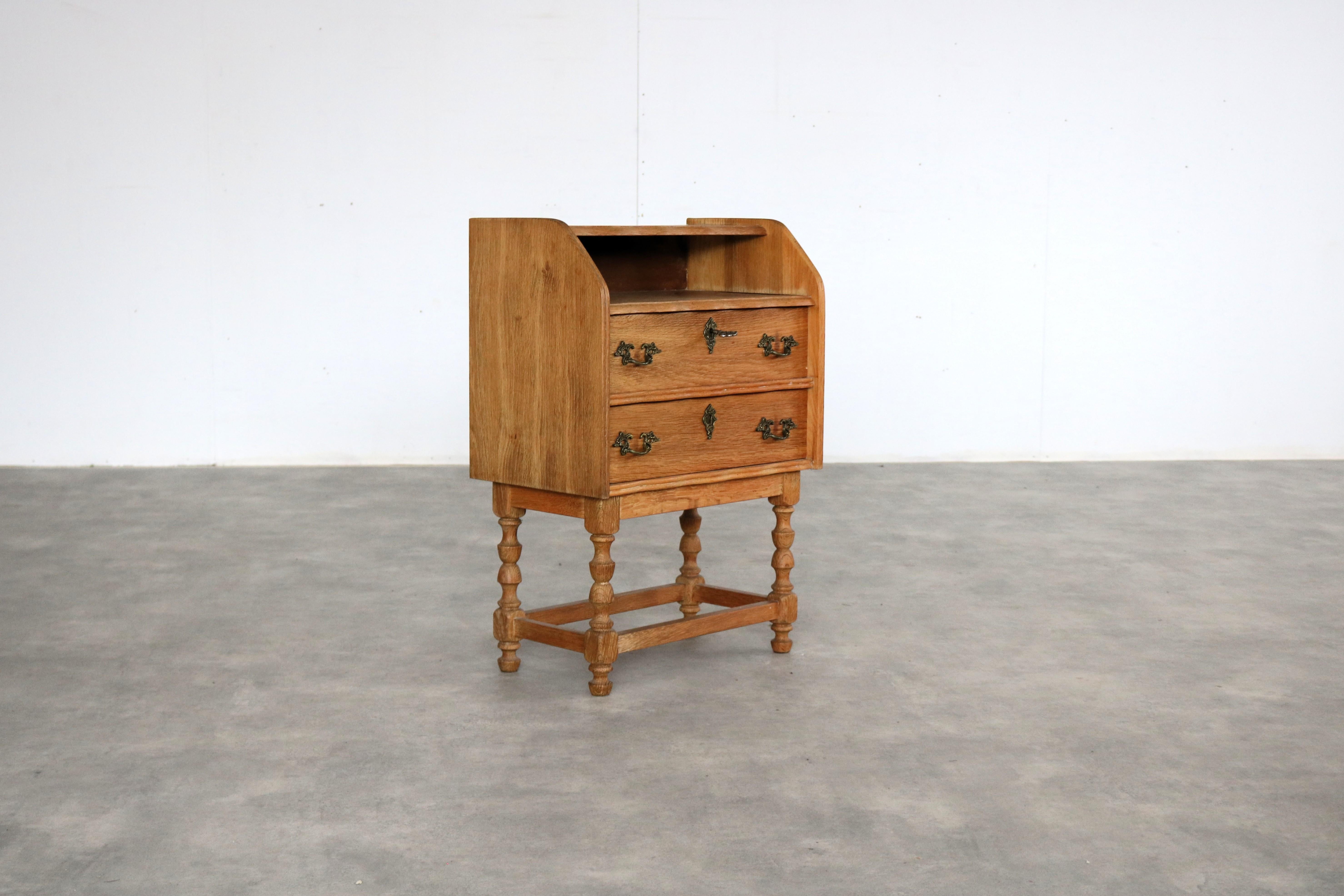 Brutalist bedside table  cabinet  1960s  Danish

period  1960s
design  style Henning Kjaernulf  Denmark
condition  good  minor signs of wear
size  71 x 49.5 x 30 cm (H x W x D)

details  oak; brass;

item number  2936