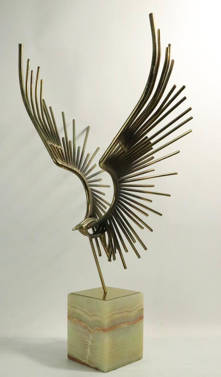 Exceptional welded rod Brutalist bird sculpture by Jere. Dramatic and expressive form, chic and stylish tabletop sculpture. This example is in very fine, original condition. Metal bird mounted on polished stone base. Base 5 W x 5 D x 6 H. Bird