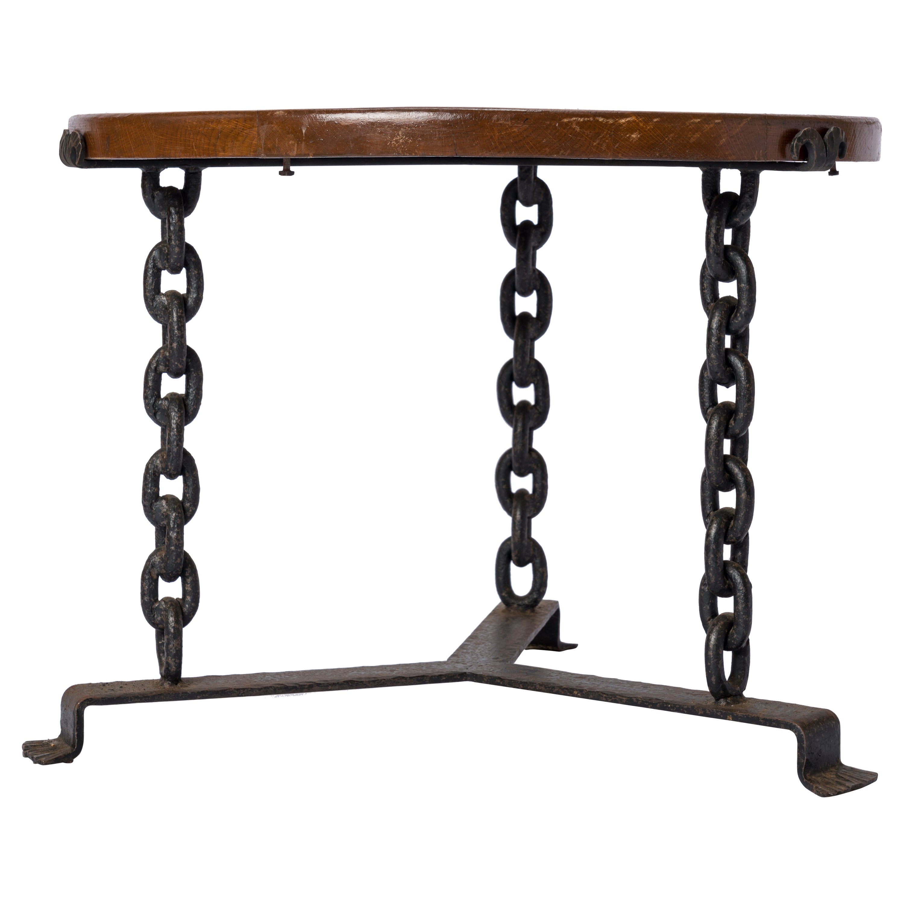 Graphic side table made of a wrought iron base, welded marine chain legs and tinted oak top. Minor stains scuffs on the oak top. Iron base and chains have not been repainted.
Sturdy.
This table will ship from France and can be returned to either