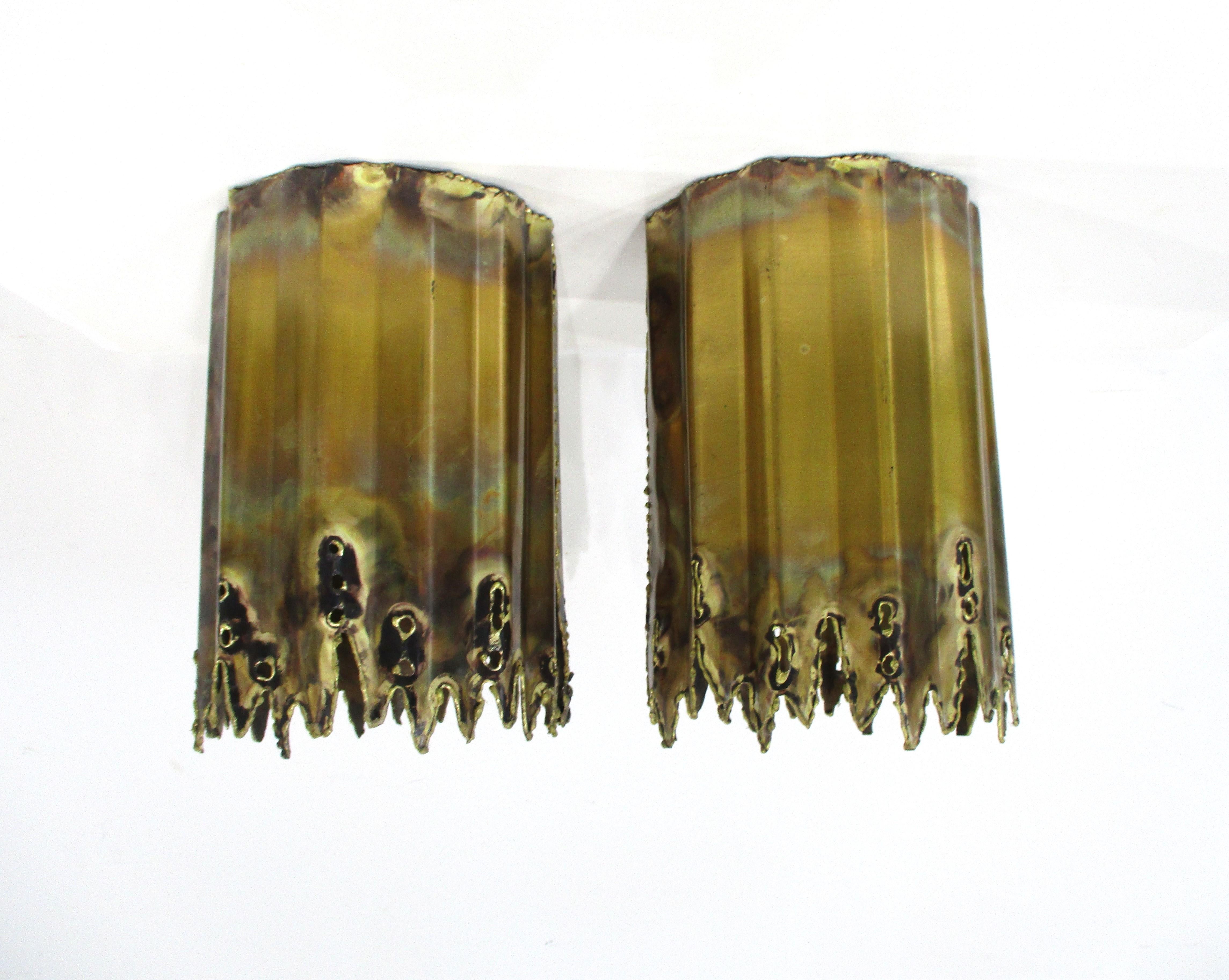 A pair of rare hard to find brass sculptural Brutalist torch cut and welded flush mount ceiling can lights . This pair was designed by Tom Greene known for his creative lighting work in metal during the 60's and 70's and are hard wired for
