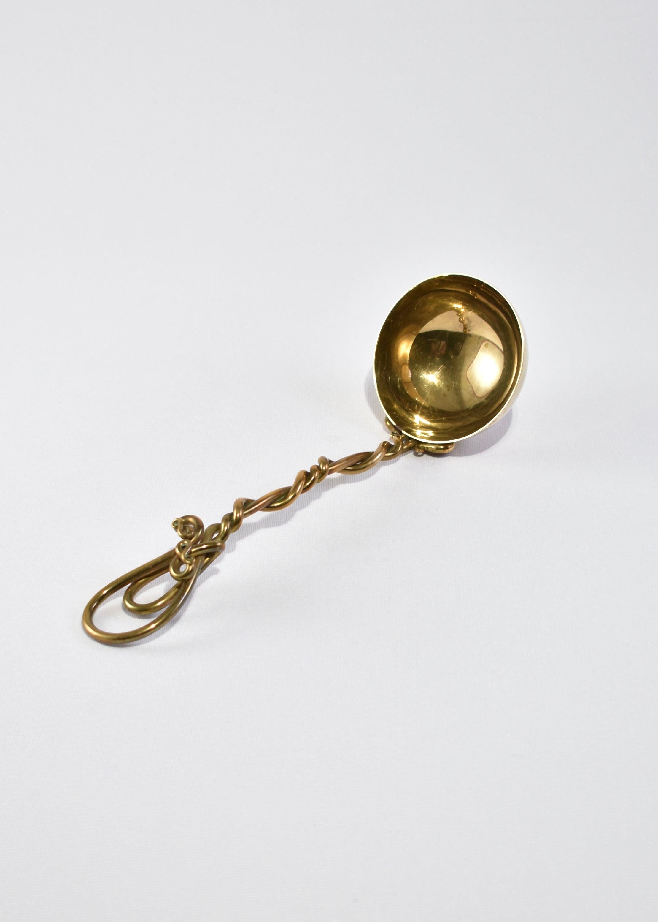 Stunning vintage brass soup ladle with a sculptural twisted handle. Designed by Joe Spoon.