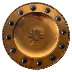Brutalist brass platter with embossed sun and onyx appliqués, 20th century 