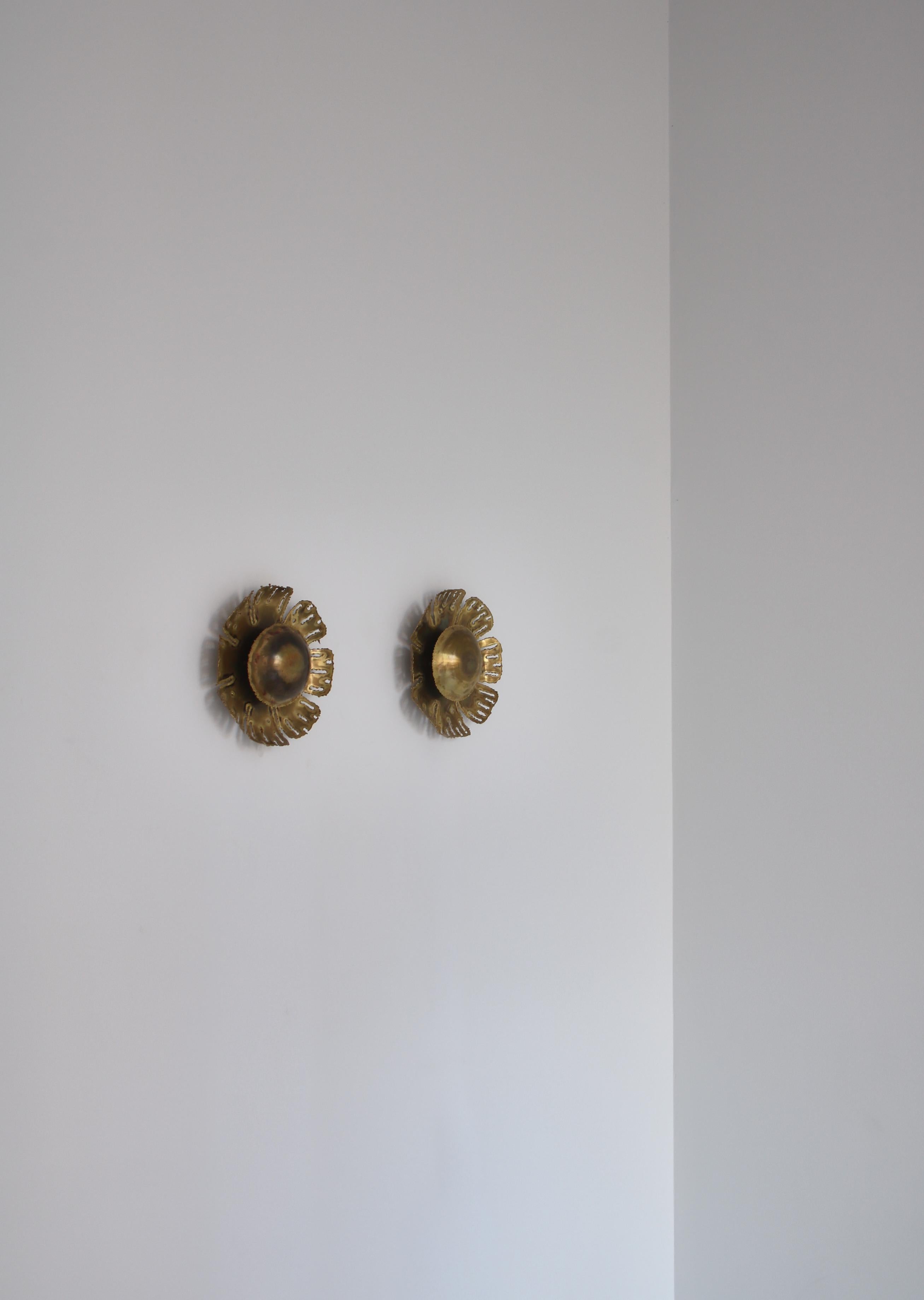 Wonderful wall sconces in Brutalist style by Danish designer Svend Aage Holm Sørensen from the 1960s. The sconces are made from solid acid cut brass and was produced by Holm Sorensen & co.´s own workshop in Denmark. The sconces are in good original