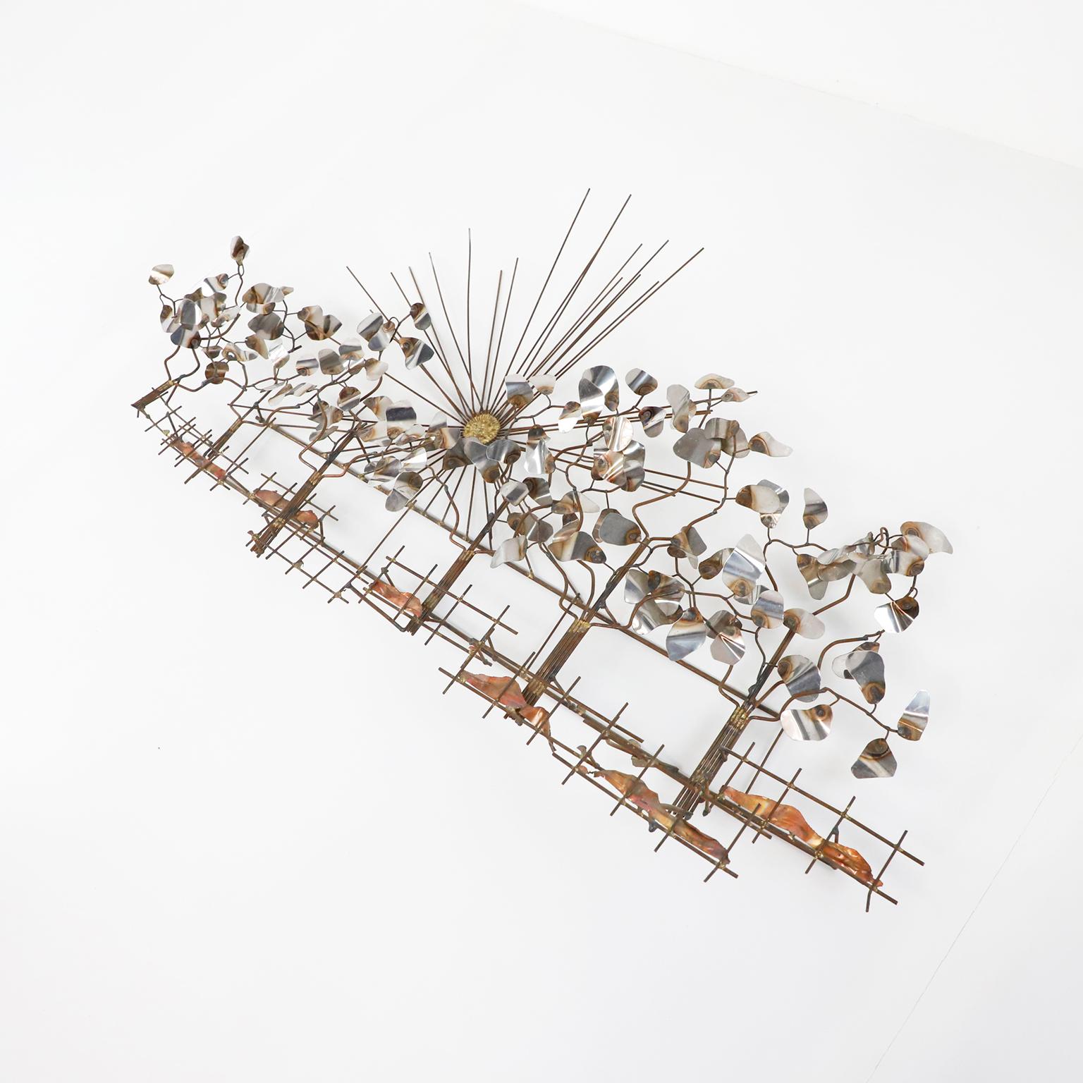 Circa 1960. We offer this Brutalist brass wall sculpture in the style of Curtis Jere.