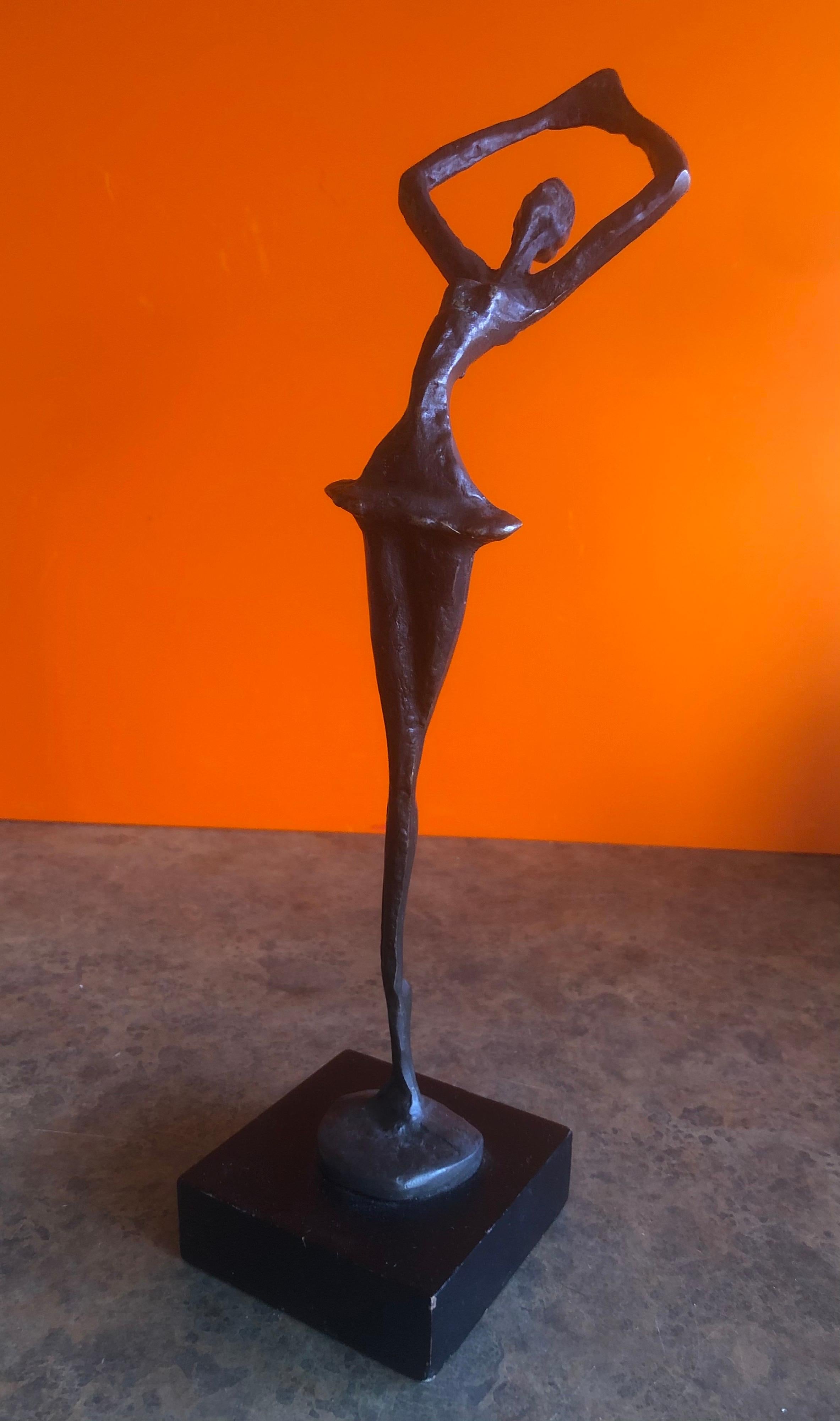 A fun Brutalist midcentury bronze ballerina sculpture on an black wood base (3.25