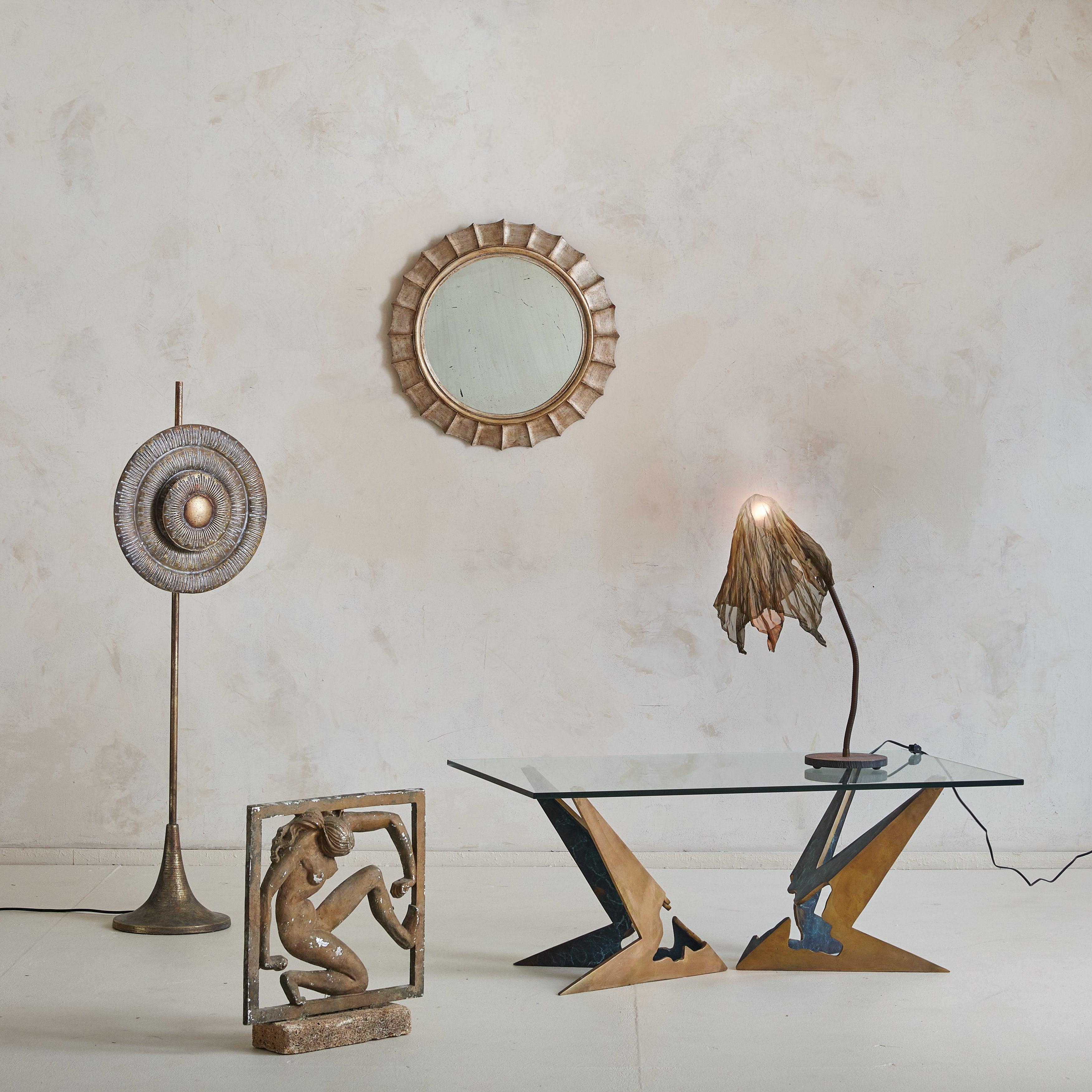 A striking 1970s Brutalist coffee table, attributed to Valenti, Barcelona. Crafted of solid cast bronze, the base is defined by angular lines and intricate cut-outs. The bronze is accented with deep emerald marbling, adding a rich contrast to the