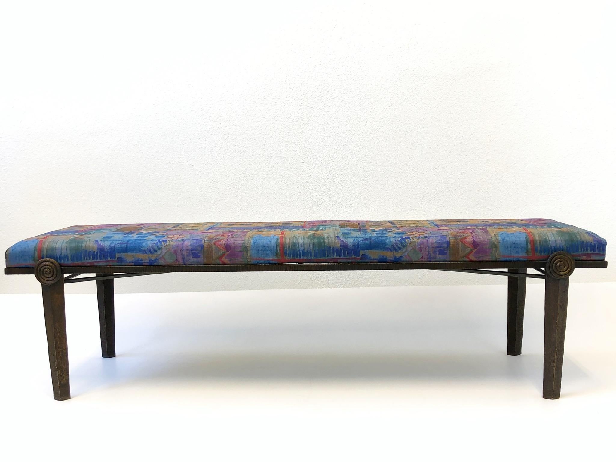 A spectacular Brutalist bronze bench designed by Tom Corbin for Steve Chase. The bench retains original fabric chosen by Steve Chase. The bench is constructed of solid aged bronze.

Measurements: 66.25” wide, 18.75” deep, 18.5” high.