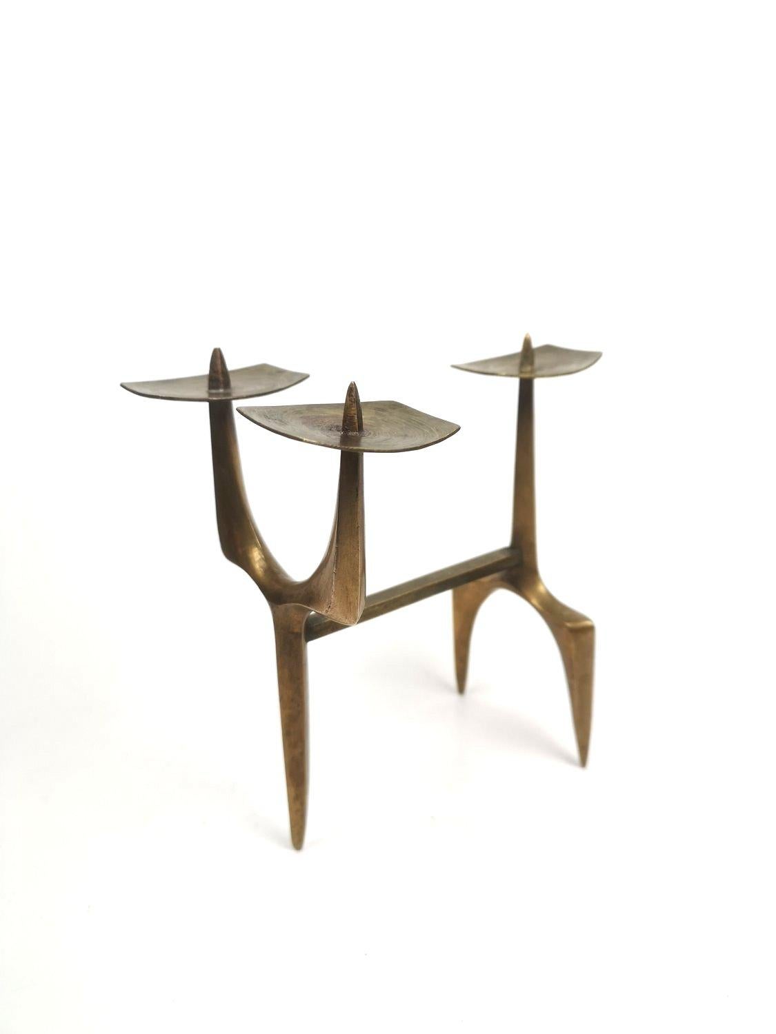 Three arm bronze candelabra, designed and hand crafted in the 1960's by Hungarian metal artist Janos Mate. Artistically a perfect representation of its period.