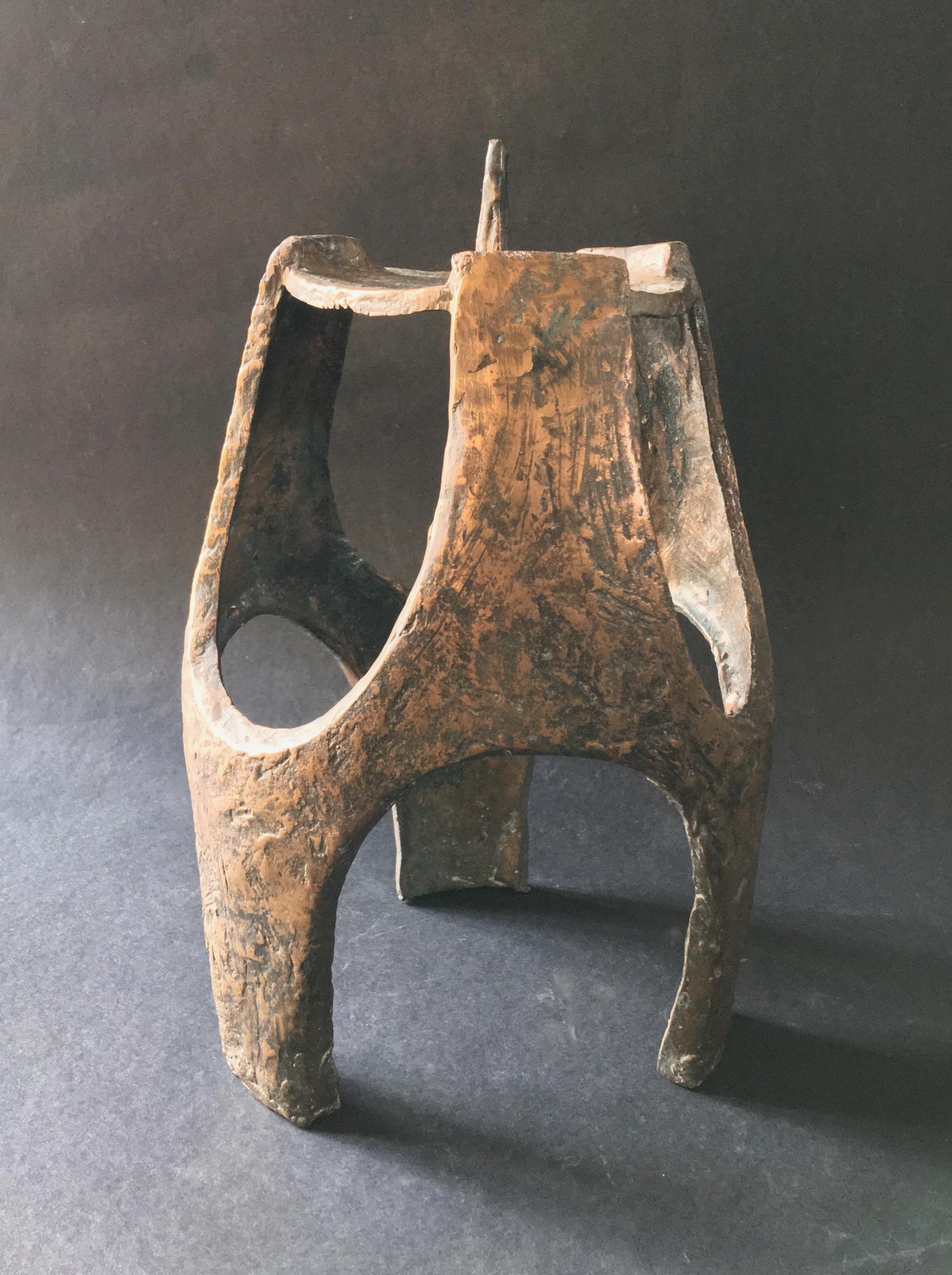 A large single candleholder, in brutalist style, of cast metal, which looks to be bronze. Found in Germany, 20th century. 

The shape has heavy surface texture and minor asymmetries from the original mould, giving it a hand-formed feel. Good