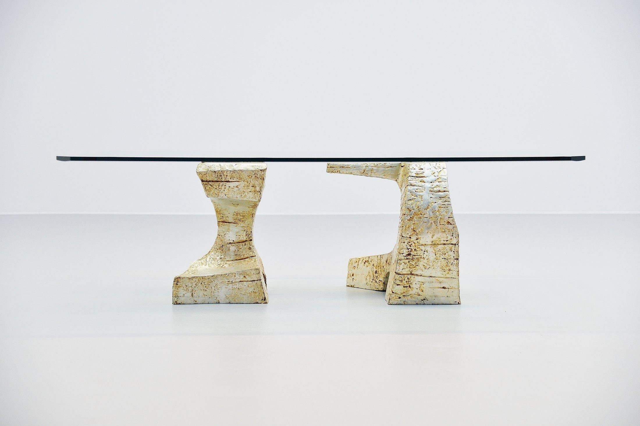 Spectacular bronze coffee table with sculptural bronze legs, made in Spain, 1970s. This fantastic sculpted coffee table has influences by Antoni Gaudi for example, you can see the strong brutalism in the architectural shaped feet. The bronze feet