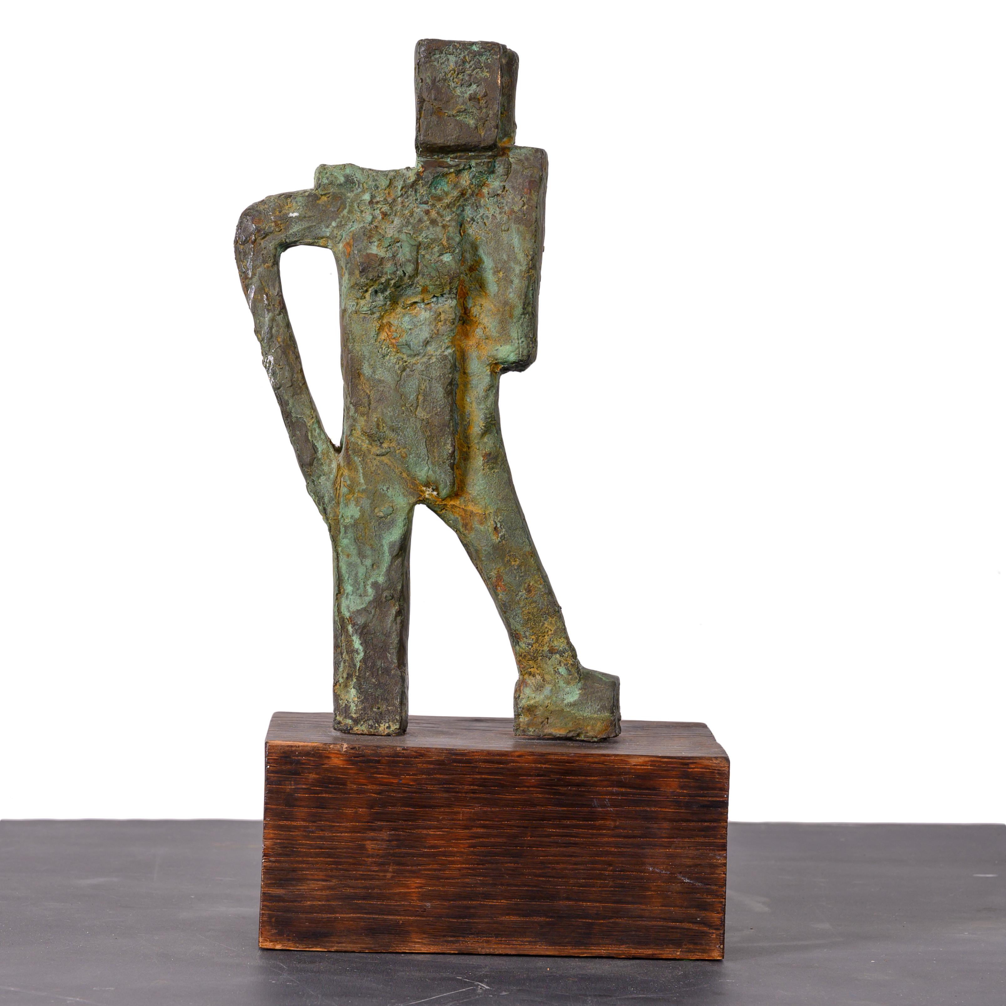 A brutalist bronze figural sculpture on oak base.

7 ½ inches wide by 4 inches deep by 13 inches tall
