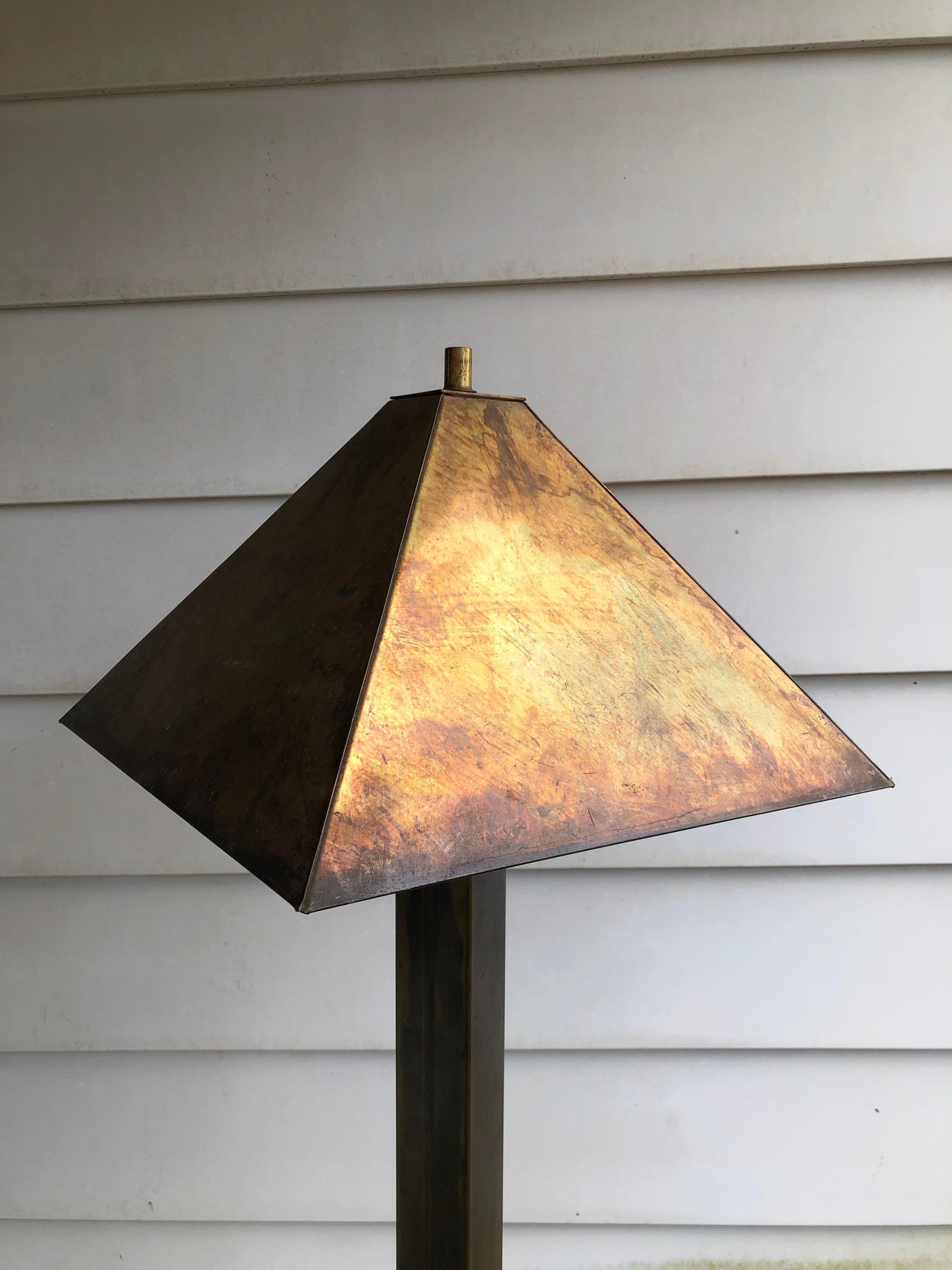 1960s midcentury floor lamps in the manner of Stewart Ross James for Hansen or Paul Evans. Probably by Laurel Lamp Co. 
 
 This interesting floor lamp with tapered shade constructed of a patinated bronze metal with flaring bases. Lamp is in