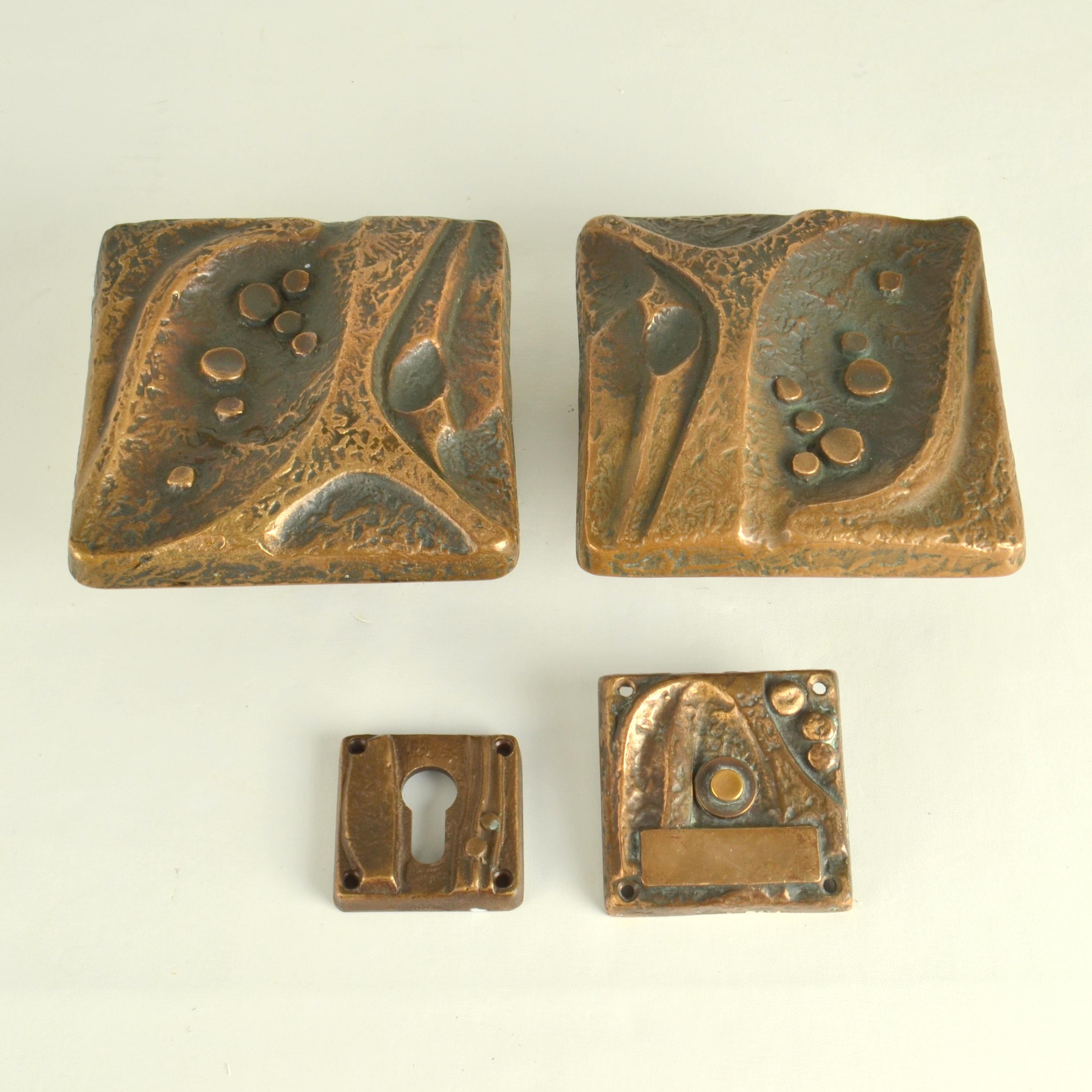 Brutalist pair of bronze door handles with strong relief of veritcal organic  lines is made in the 1960-70's. These heavy pieces, made of cast bronze are in perfect condition and are an artwork for your doors. The bronze is oyidized, creating a
