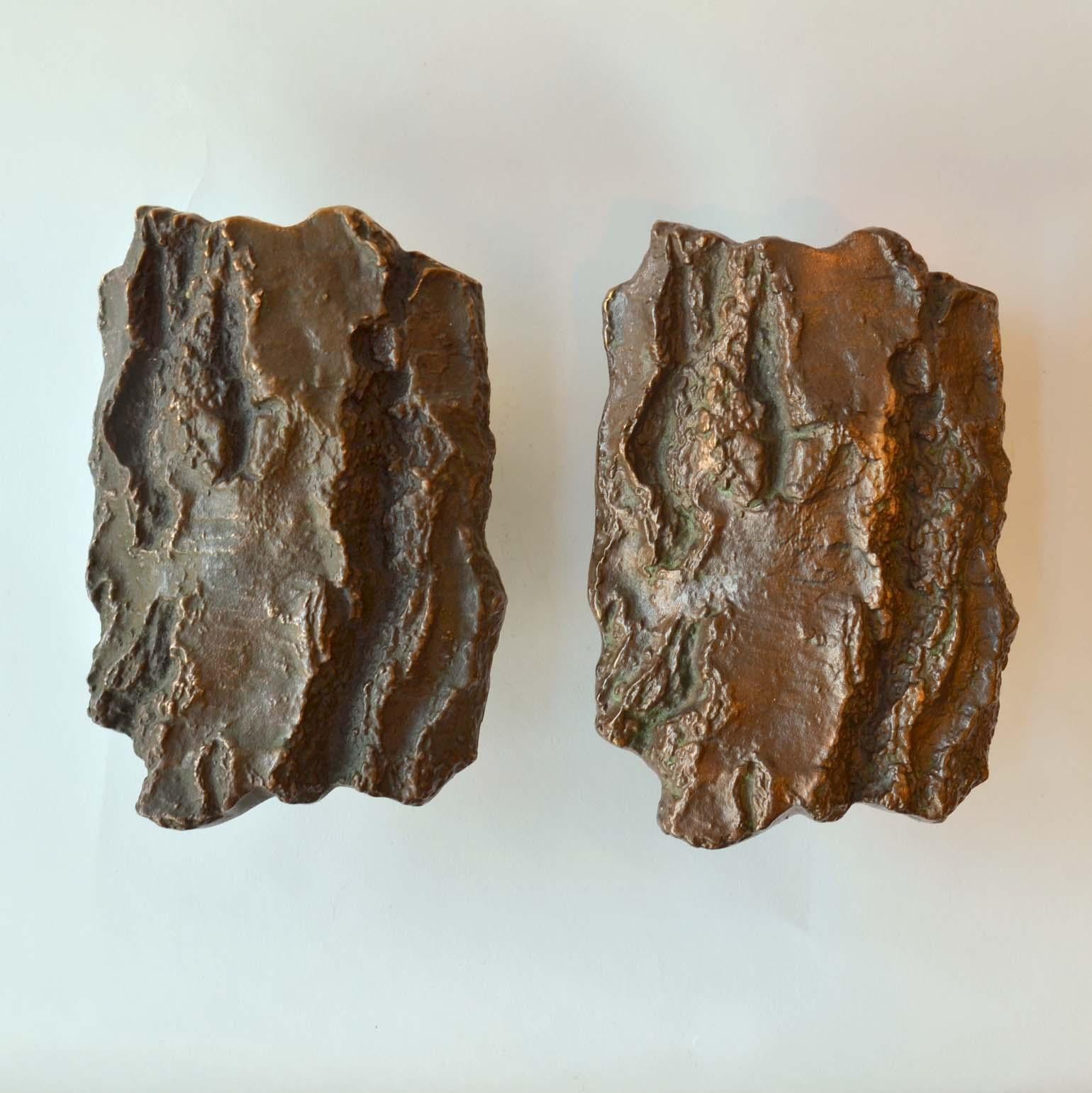  A set of two artistic brutalist bronze door handles with textured tree bark design, European 1970s that give real personality to a house. The handles are heavily textured and slightly curved, with lots of movement and depth in the design. They both