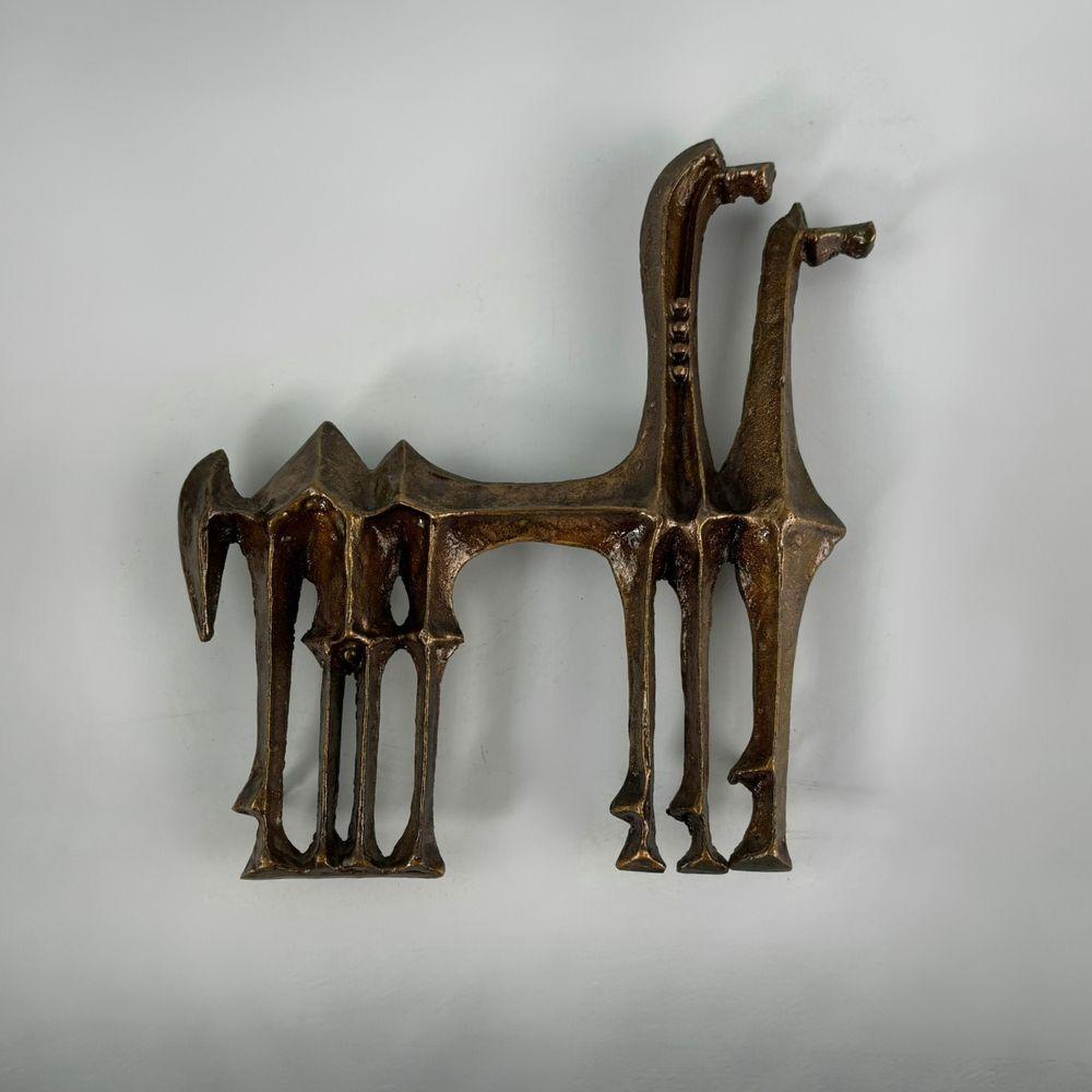 Bronze Camels Wall Sculpture with Brutalist Style, a Characteristic Work by Zoltán Pap. This rare collector's piece immediately captures attention with its distinctive presence. Its back features protrusions allowing for wall mounting if desired.
