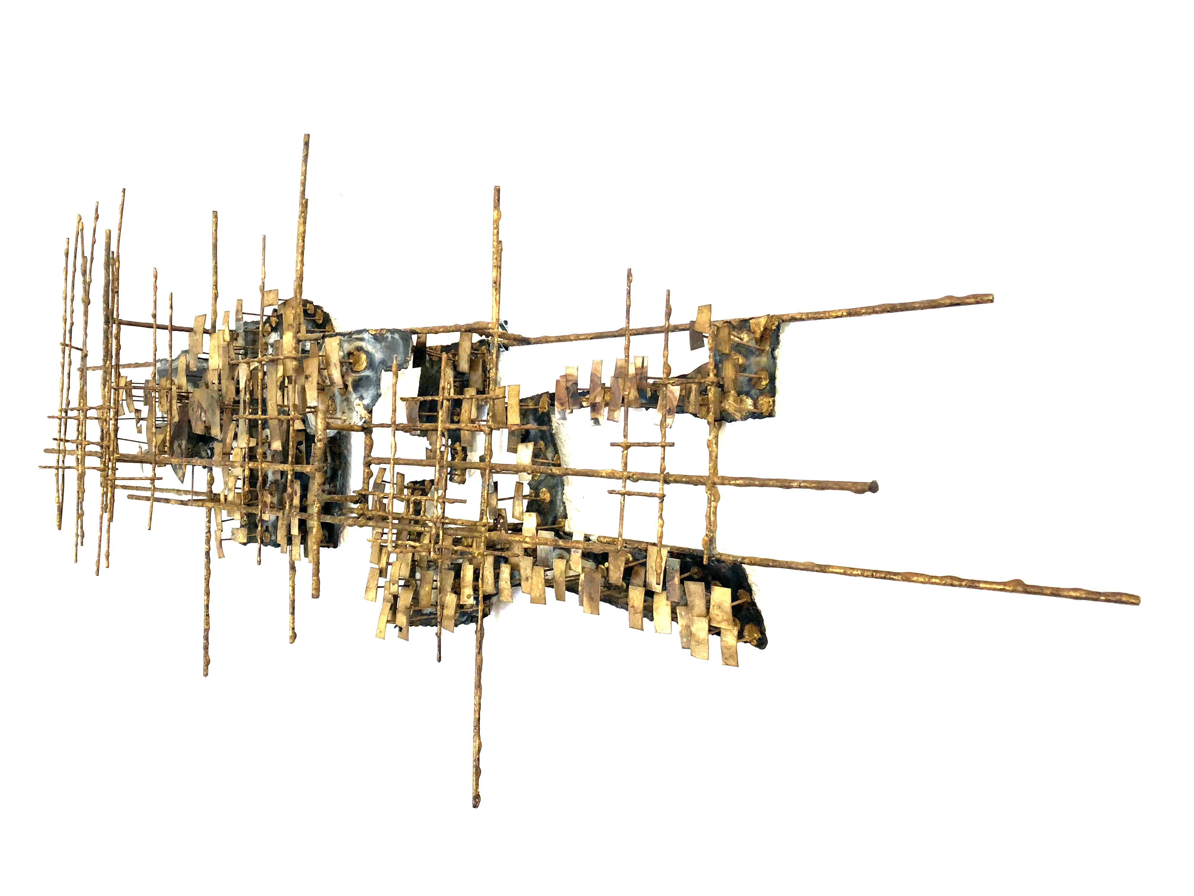 A magnificent and captivating Brutalist wall sculpture in bronzed metal. This sculpture is unsigned, but incorporates scrap stamped metal, in the manner of Marc Creates.

Artist and inventor Mark Weinstein of Saint Louis Missouri, established Marc