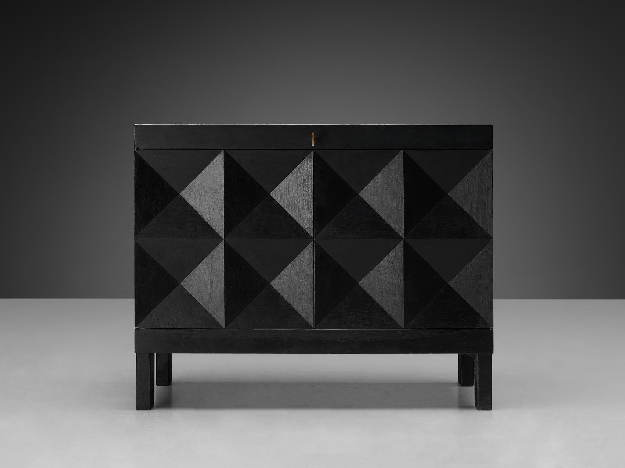 Brutalist cabinet, oak, Belgium, 1970s. 

This cabinet is a real eye-catcher in the style of De Coene. The cabinet shows an intriguing graphic pattern on its doors. The sideboard features graphical designed doors that add a wonderful rhythmic and