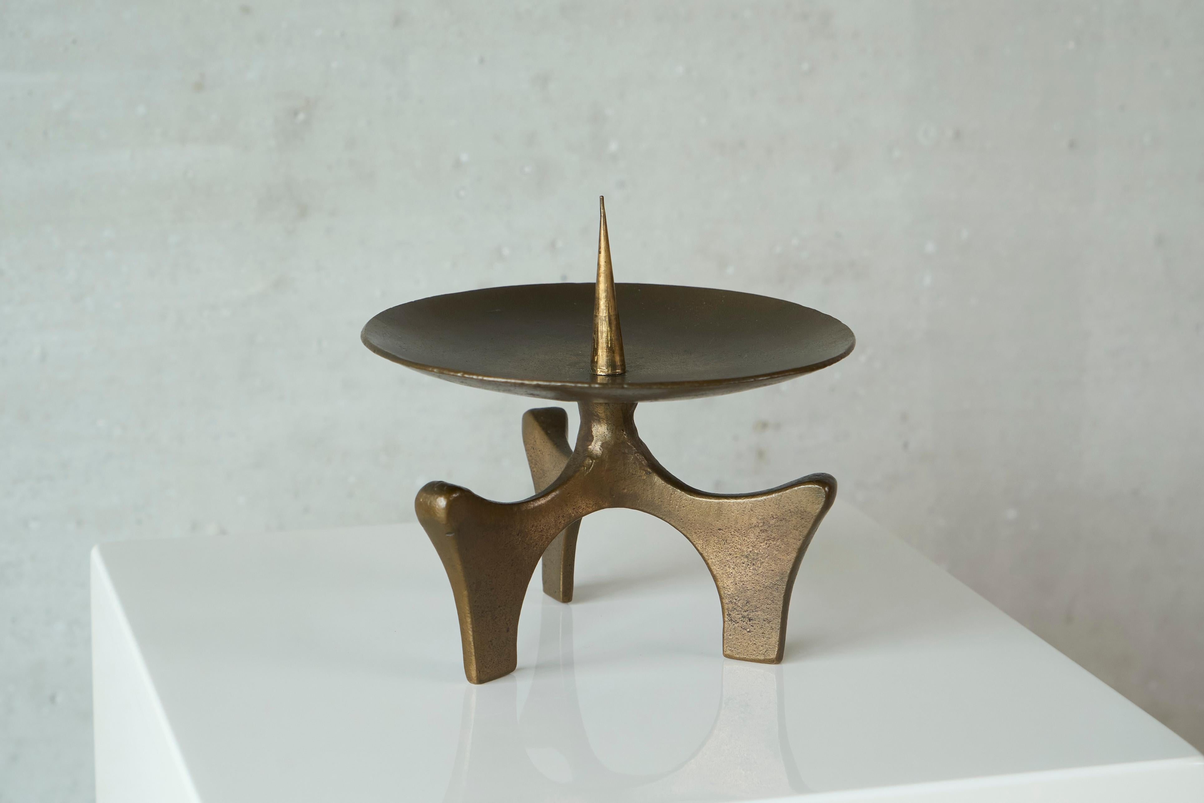 Brutalist Candle Holder in Patinated Sand Cast Brass, Europe, 1960s.

A very distinct brutalist style candle holder in heavy sand cast brass with a lovely patina. Quintessentially mid 20th century. 

Great tripod design with a nice and tactile