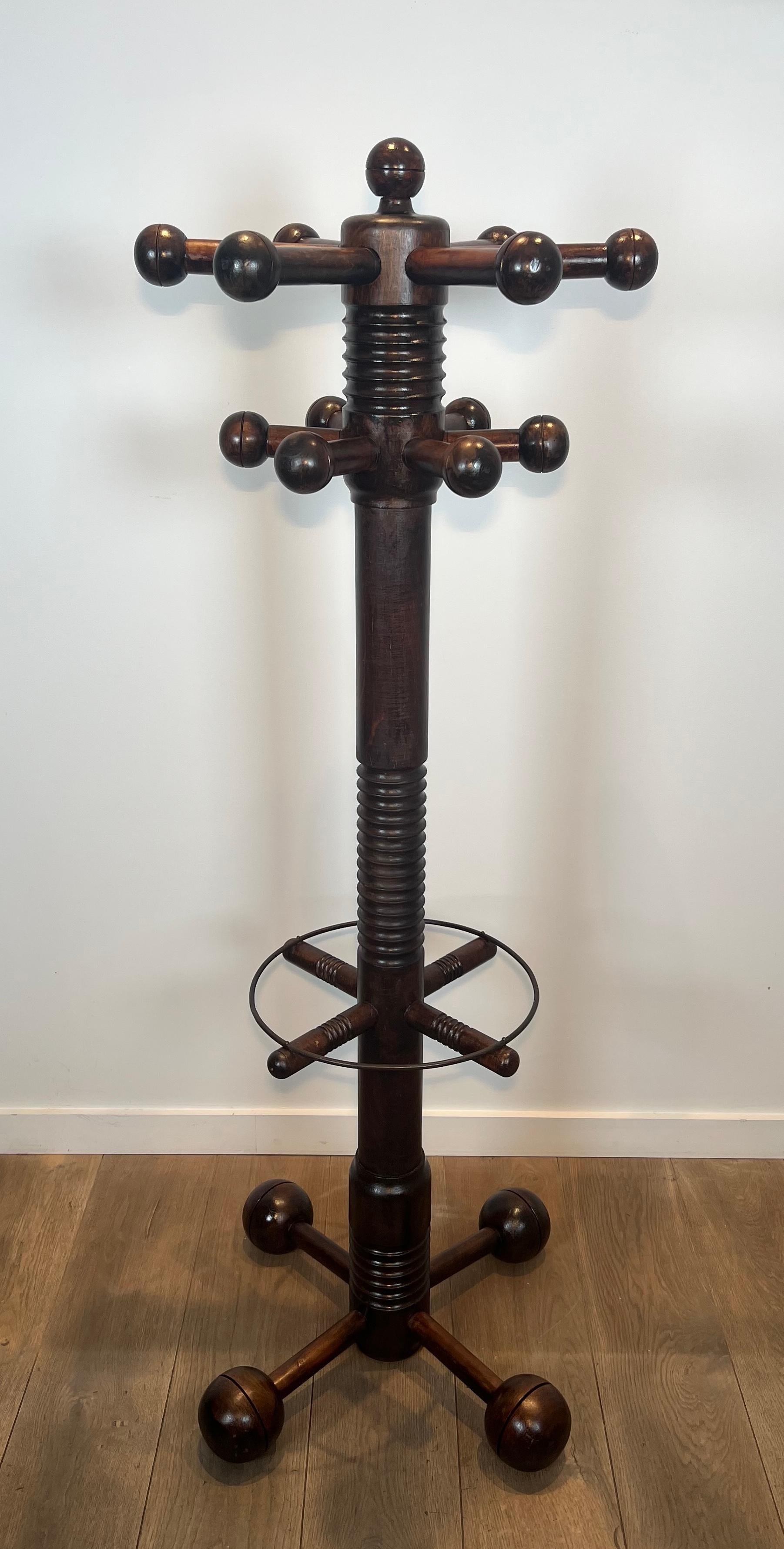 This very nice and decorative brutalist coat rack is all made of carved oak. This isa French work by famous designer Charles Dudouyt. Circa 1950