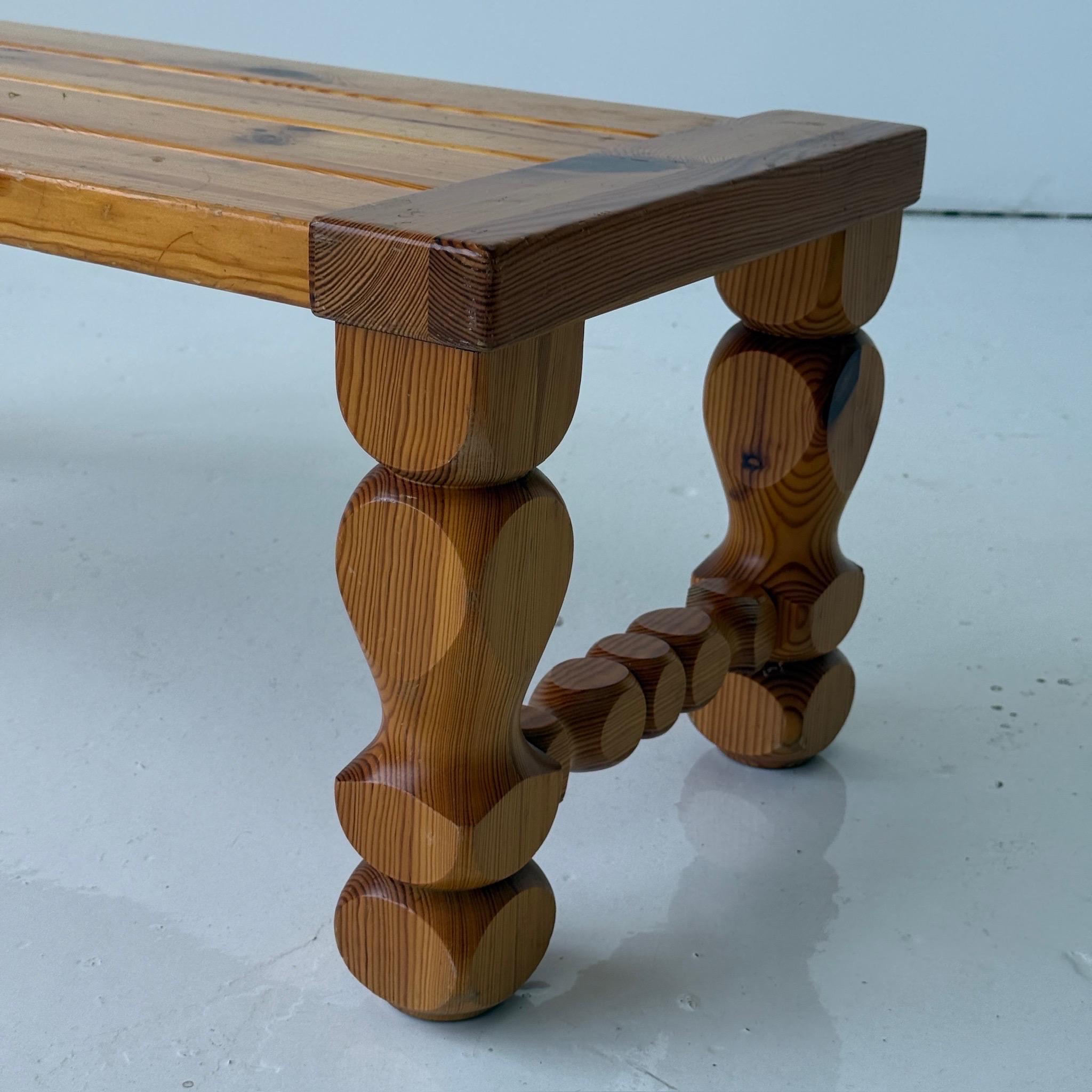c. 1970s. Sweden. Carved bench with full line construction. 

