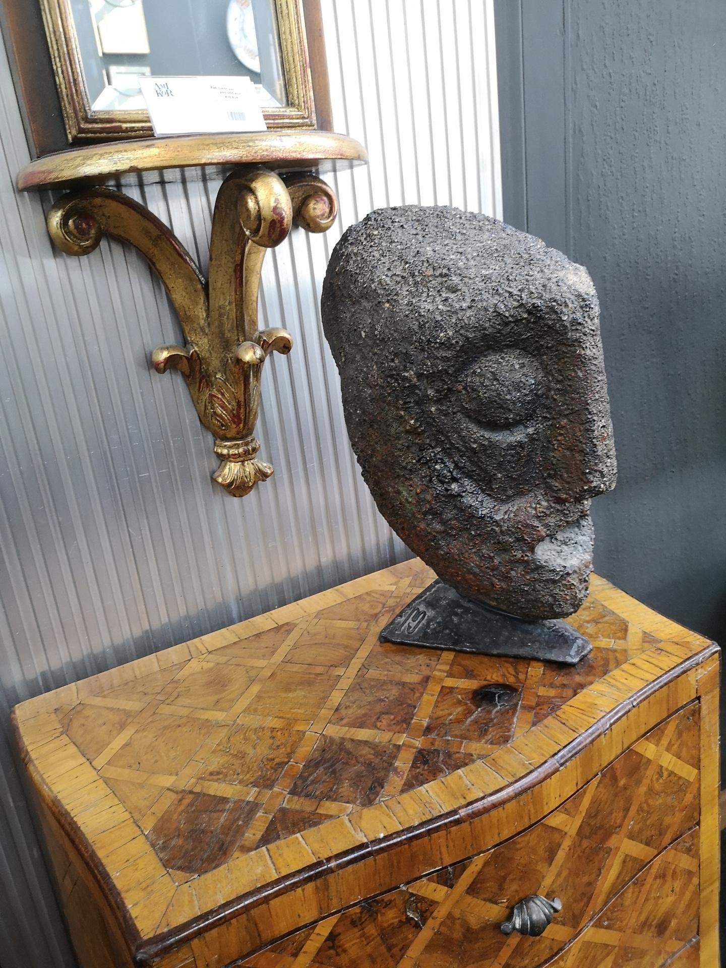 This massive carved stone head was made by Jeno Murai, in the 1970's in brutalist style, and and sits on a steel base, which is signed 
