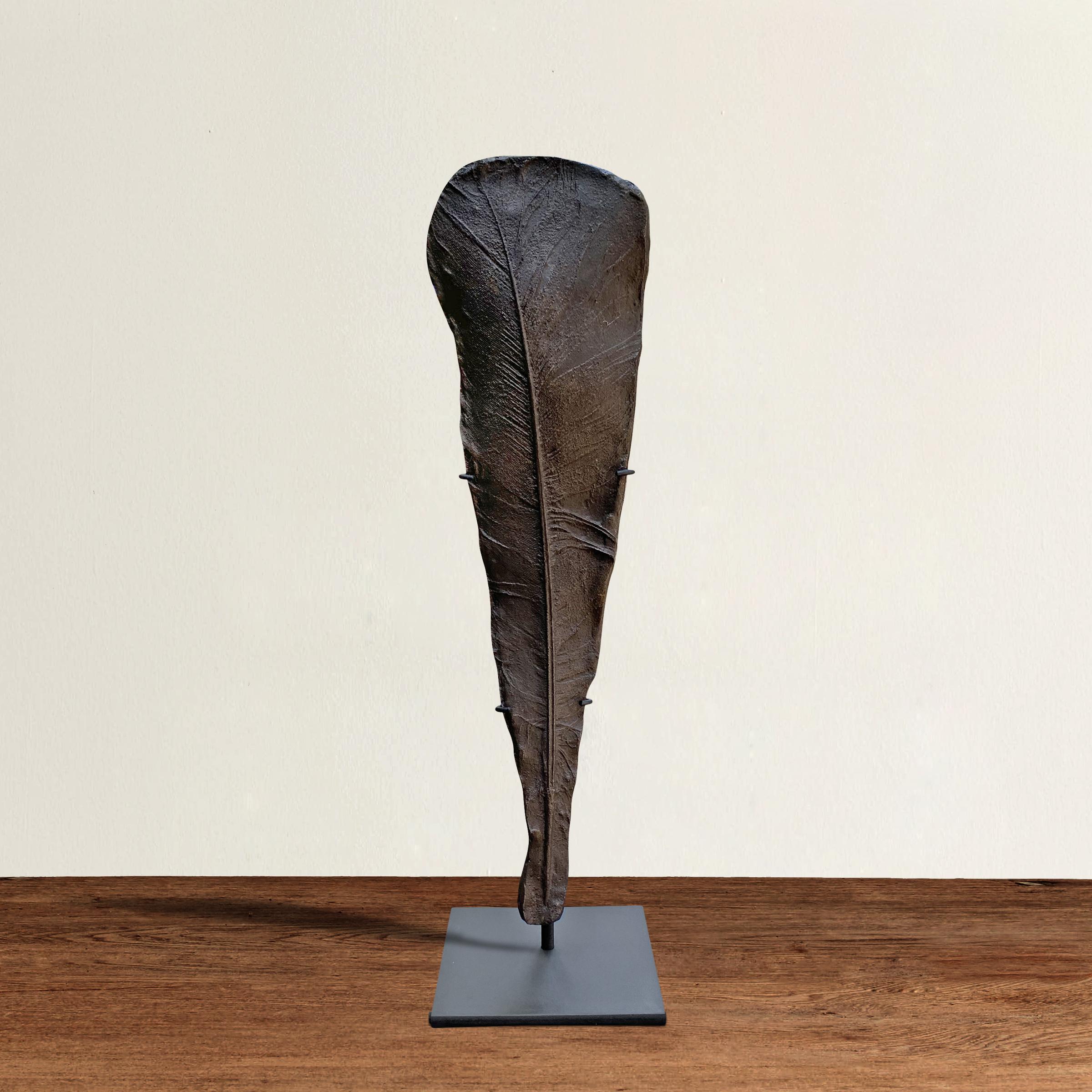 A wonderful American one-of-a-kind artist-made cast-iron turkey feather sculpture, cast from life and Brutalist in spirit, and mounted on a custom steel stand.
  