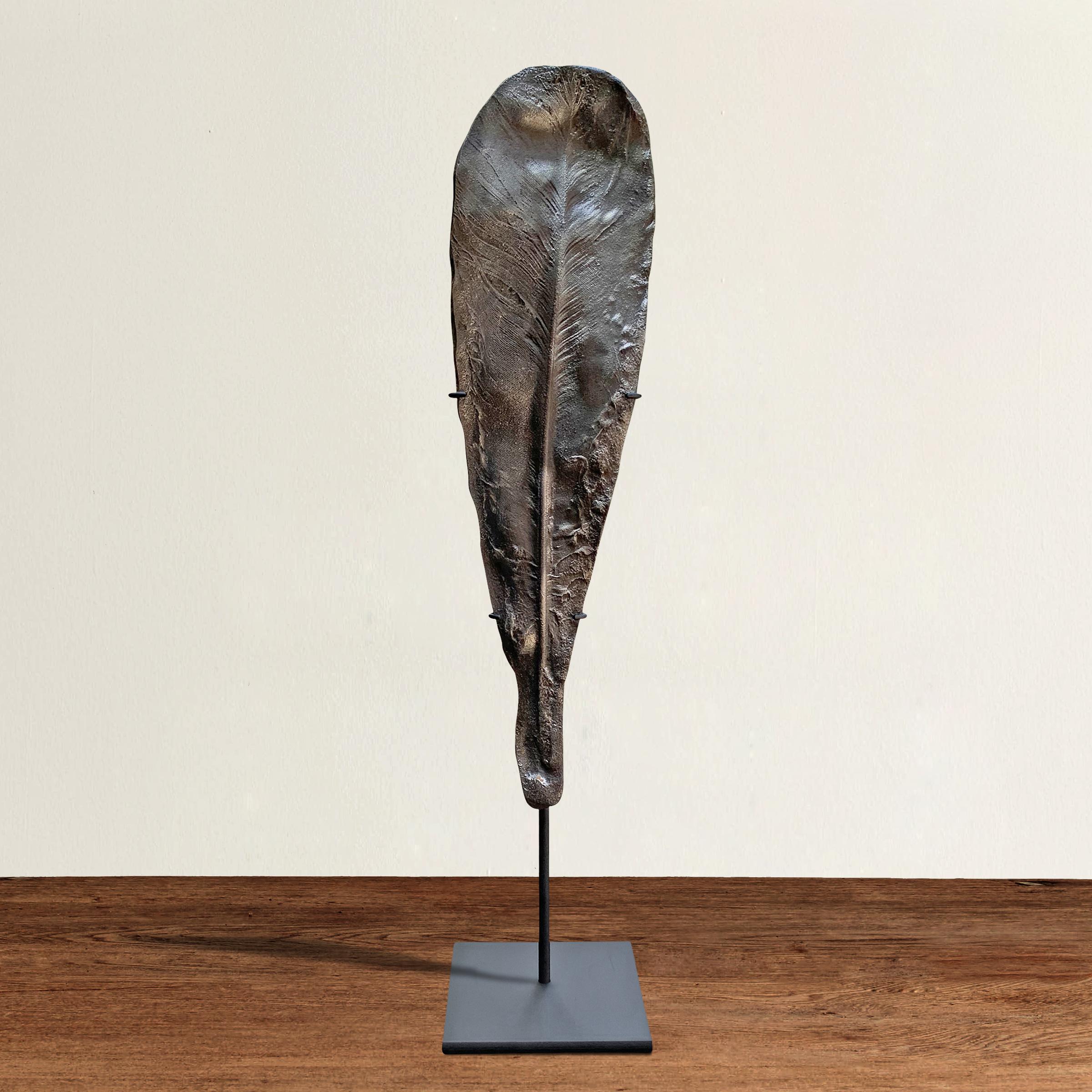 A wonderful American one of a kind artist-made cast-iron turkey feather sculpture, cast from life and Brutalist in spirit, and mounted on a custom steel stand.
  