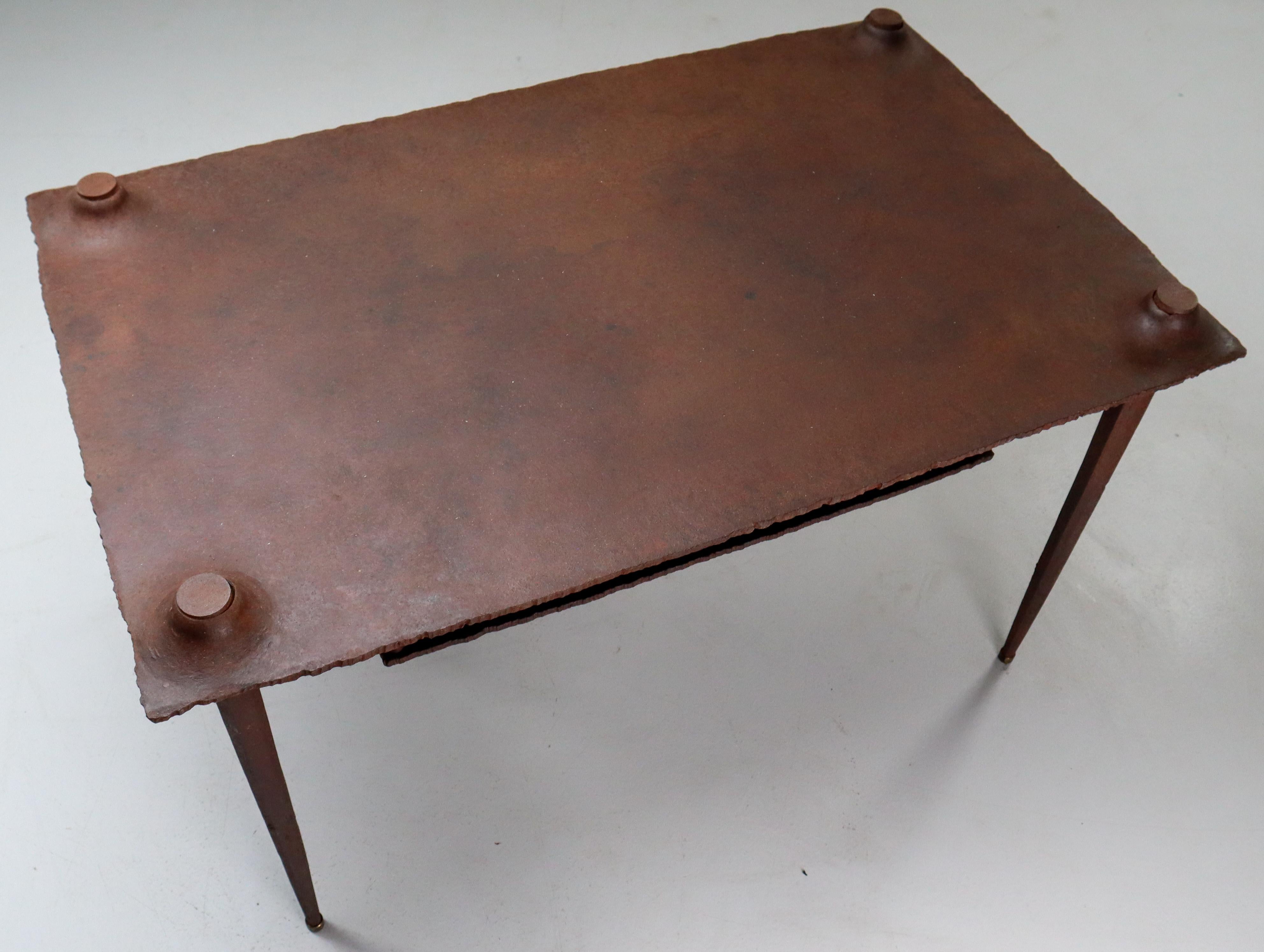 Brutalist table with shelf for magazines by Idir Mecibah (1958-2013), produced by Smederij Moerman, 1998. This solid steel table is from the scrab series. Mecibah designed the scrab series in the late 1980s and the table has been produced till the