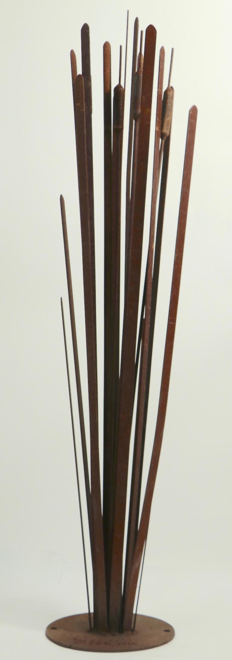 Brutalist metal garden sculpture of cattails, in all-over rust surface finish, signed by noted sculptor Michael Mladjan. Well executed and substantial, attractive garden sculpture, signed, clean and ready to use.