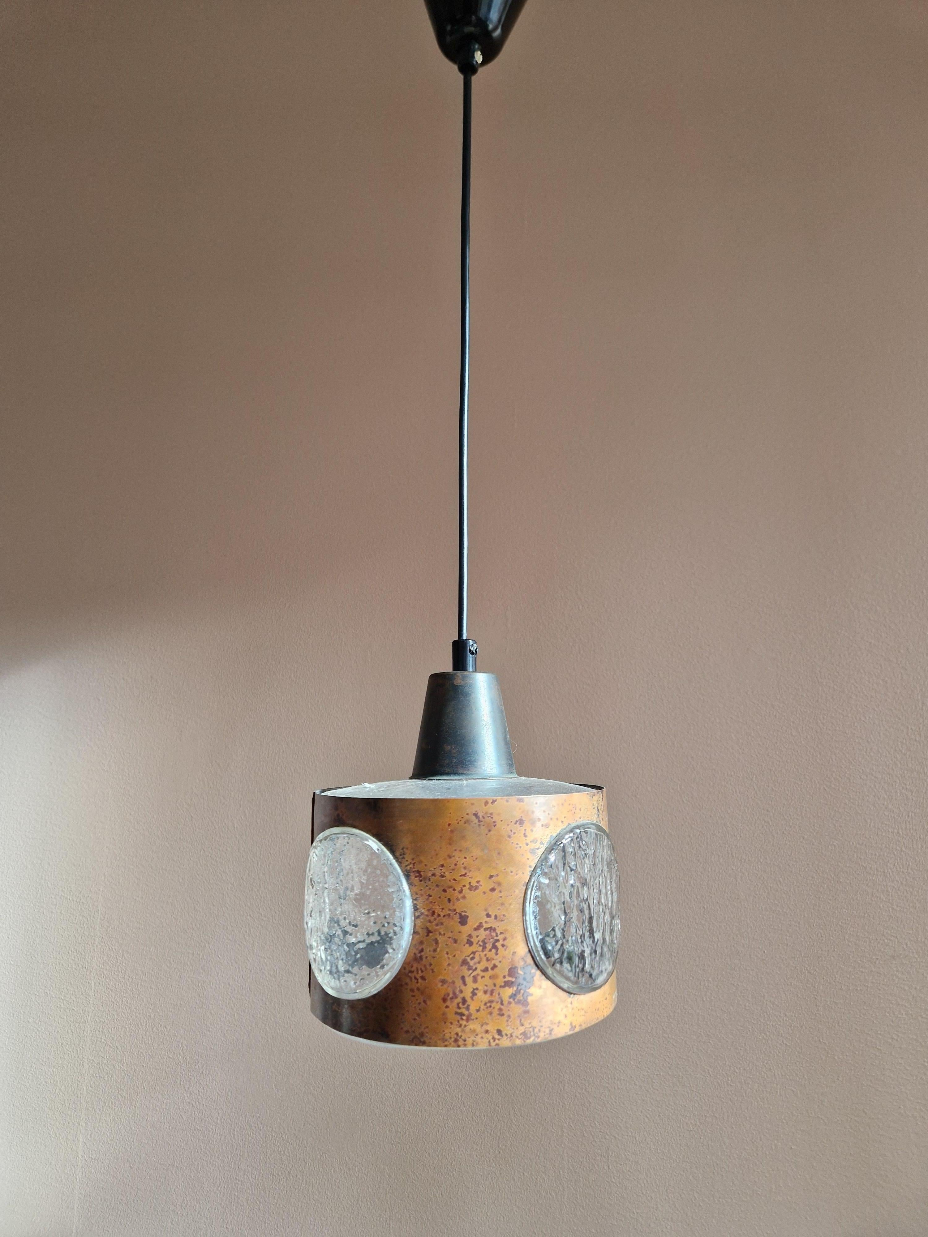 Stylistic ceiling lamp by Nanny Still for RAAK, Amsterdam. Made in the 1970's. Very muck like a sculpture it hangs, made from copper and glass. Would look great above any table table or window.
Good original condition.

Rewired.