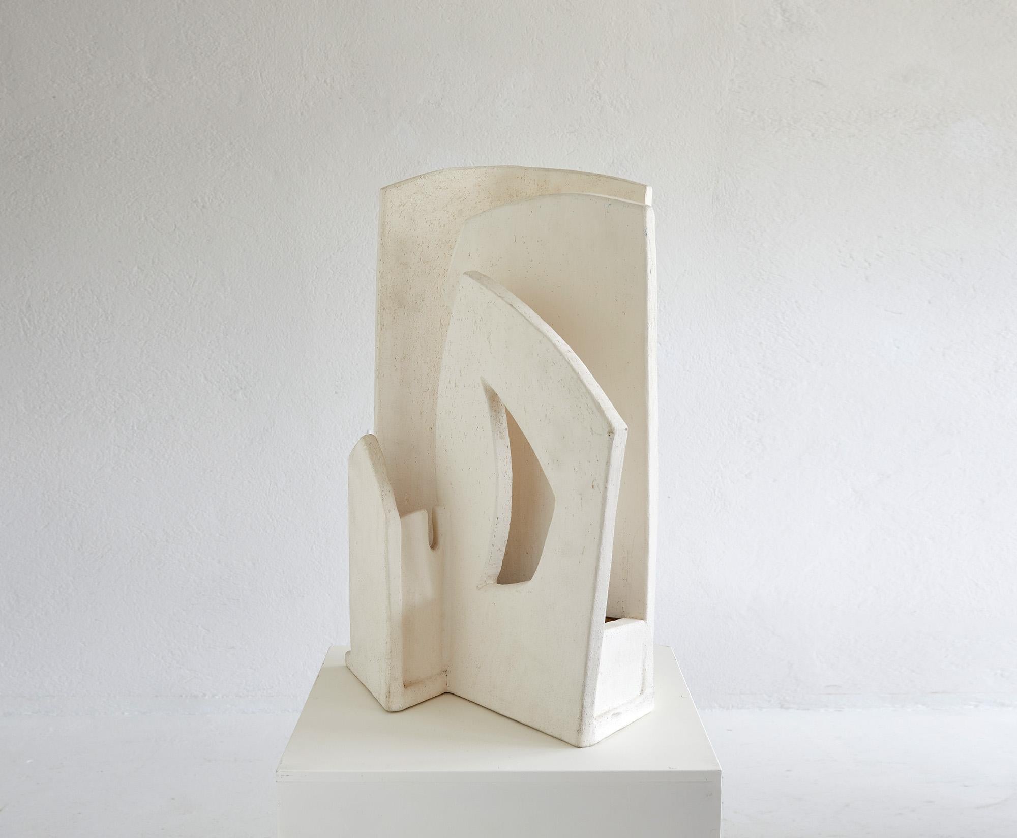 Impressive brutalist lighting sculpture made in France probably around 1970-1980.

Composed of four asymmetric ceramic panels of different sizes and shapes the sculpture produces a beautiful warm glow when illuminated. 

The lamp features also a