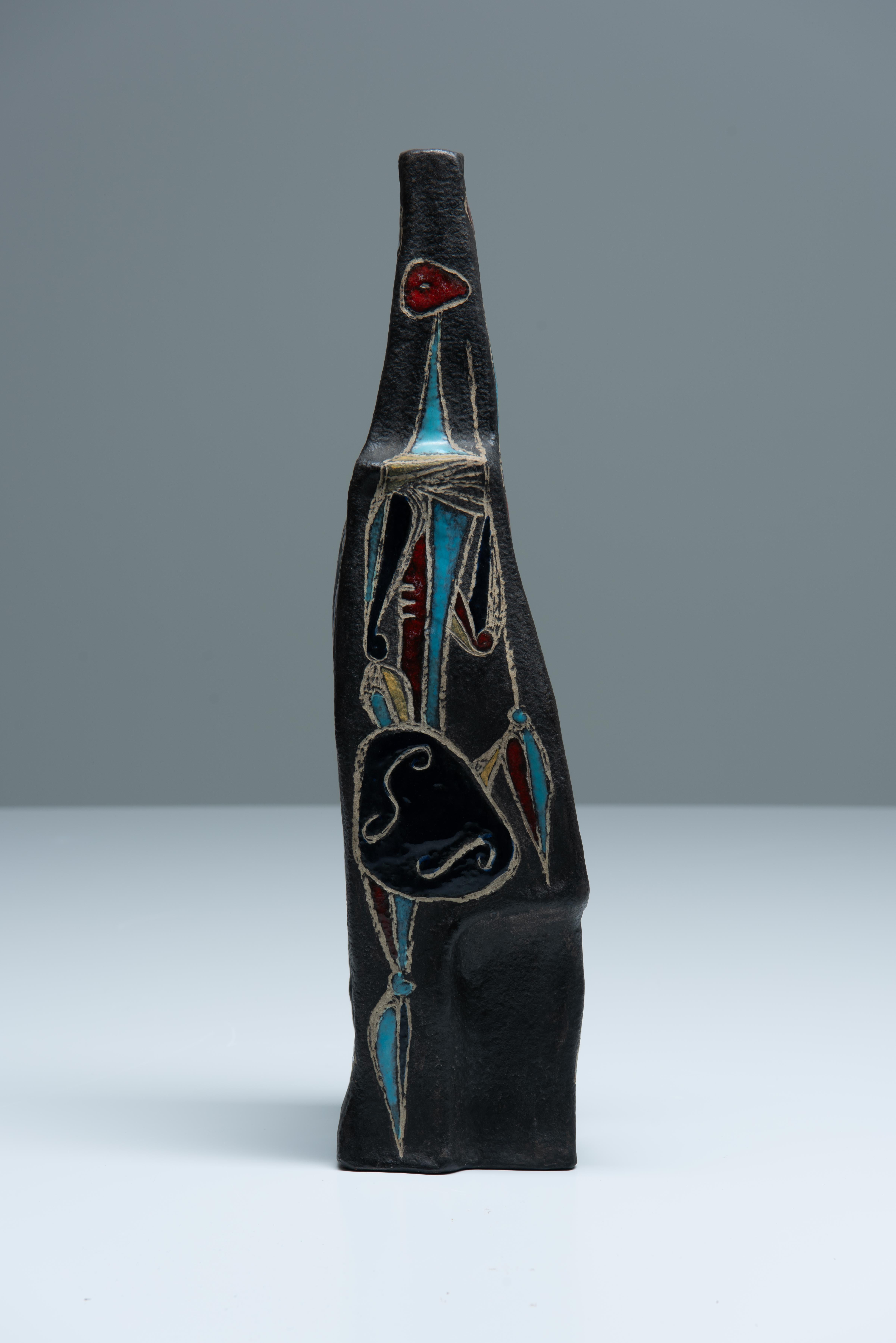 Brutalist glazed ceramic vase by Marcello Fantoni depicting 4 Cubist African warrior figures on each facade. Signed on bottom, made in 1957 in Firenze, Italy.