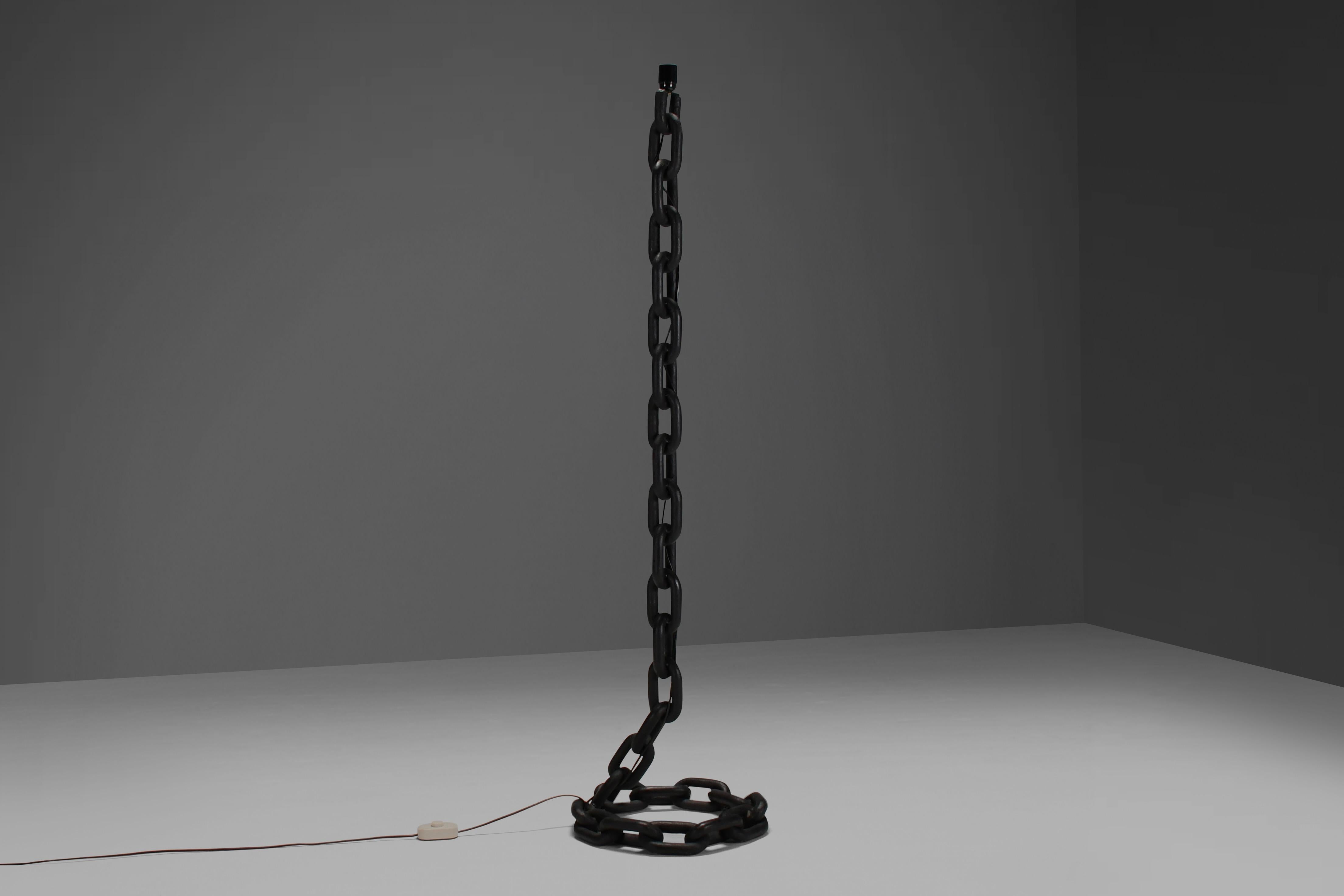 Very heavy brutalist floor lamp in very good condition.

Made from rustic iron chain which is welded together and is lacquered in a matte black color.

This lamp is attributed to the Austrian Artist Franz West.

We offer a variety of insured