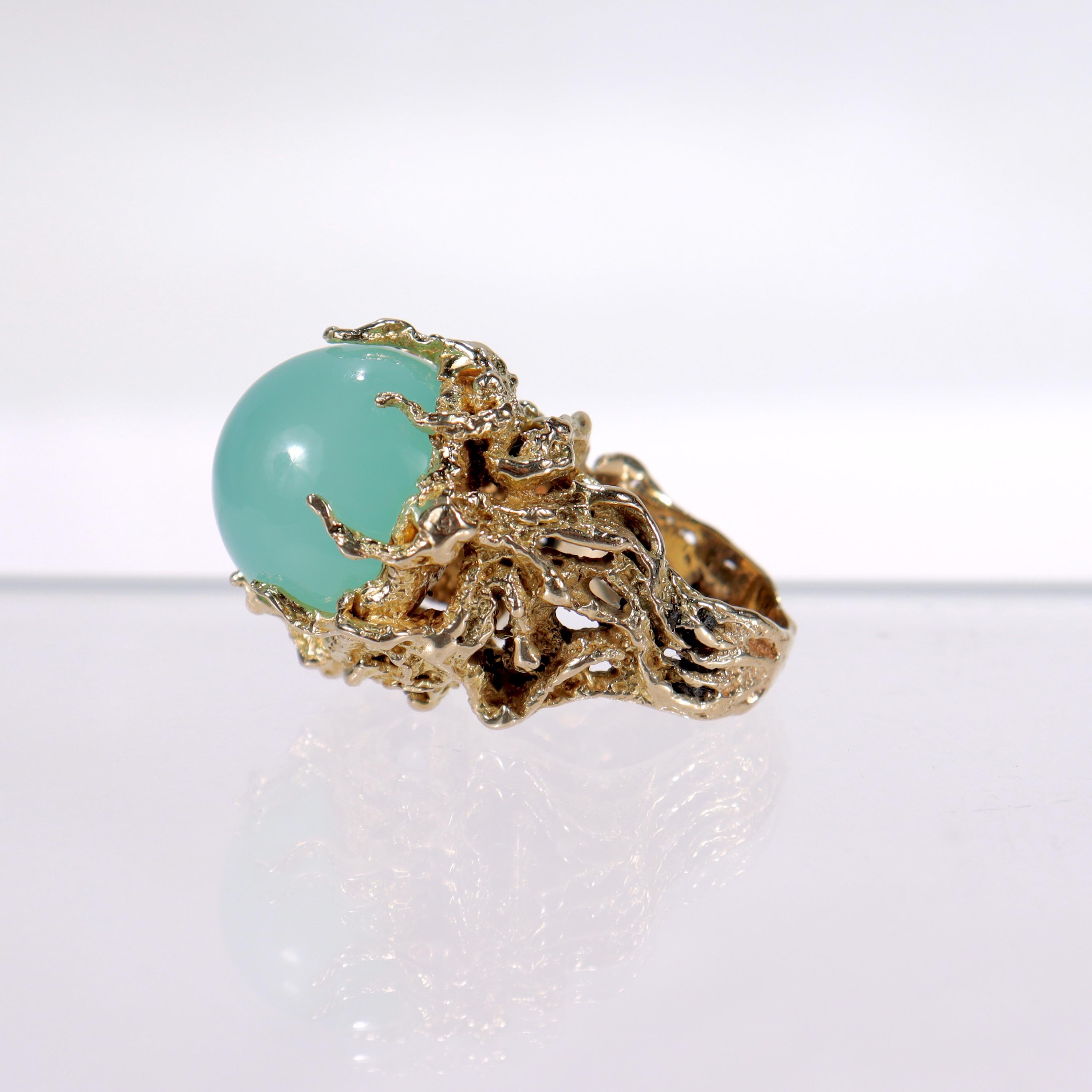 A very fine Brutalist ring.

With a smooth, round light green chalcedony cabochon prong set in 14k gold.

Simply a fantastic, eye-catching ring!

Date:
20th Century

Overall Condition:
It is in overall good, as-pictured, used estate condition with