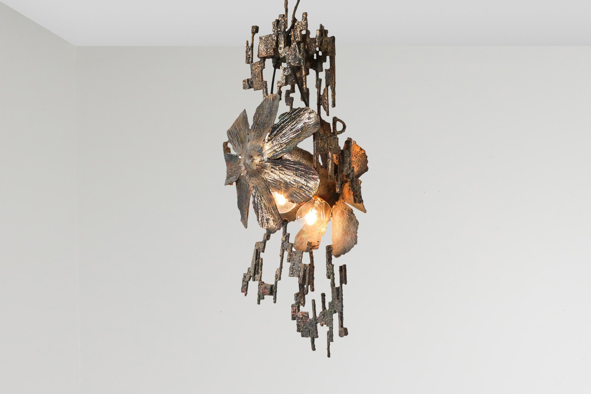 Brutalism, art, chandelier, 

Would fit well in an interior inspired by Paul Evans, Pia Manu and Gianluca Pacchioni

Salvino Marsura is an Italian artist born in Treviso in 1938. 
His career started in the 1950s, with a body of work comprising