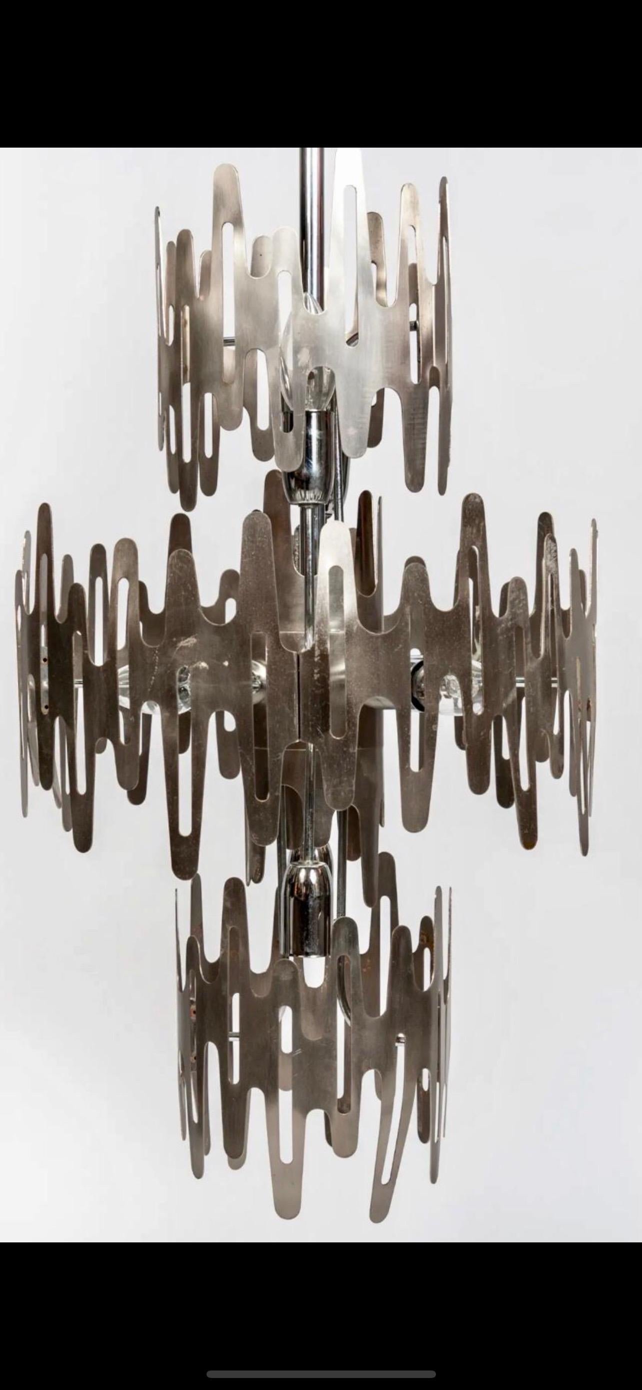 Unique model of brutalist chandelier in stainless steel, French work from the 70s. it is careful work and a true brutalist model.

special order from a French artist for a residence in Ibiza Spain. collector of exceptional brutalist pieces