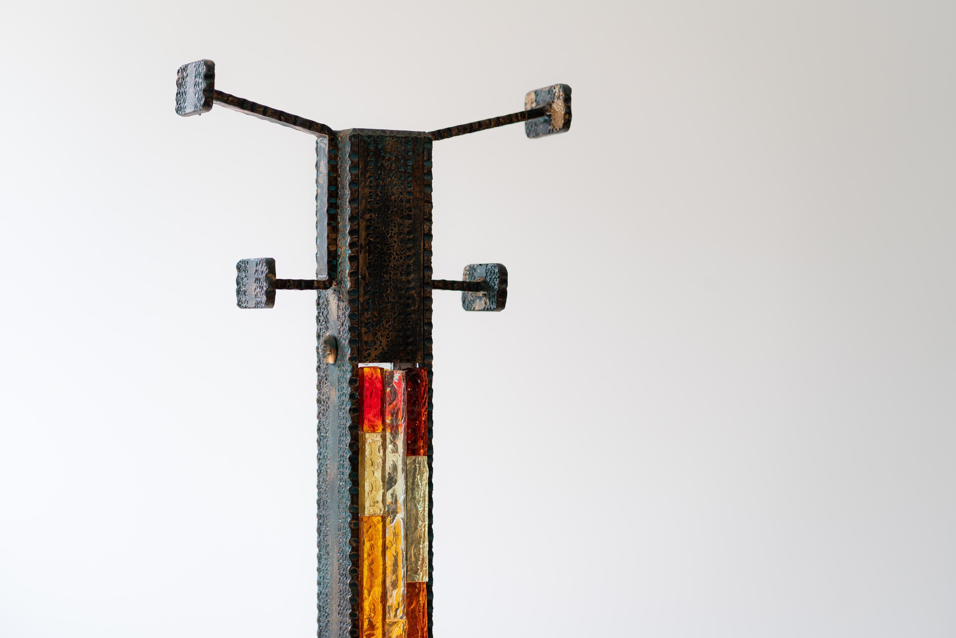 A rare and illuminated coat rack with integrated umbrella stand.
A striking example of Italian Brutalist design, this sculptural coat rack was crafted by Poliarte in the 1970s. The piece combines raw, hand-forged wrought iron with thick, textured