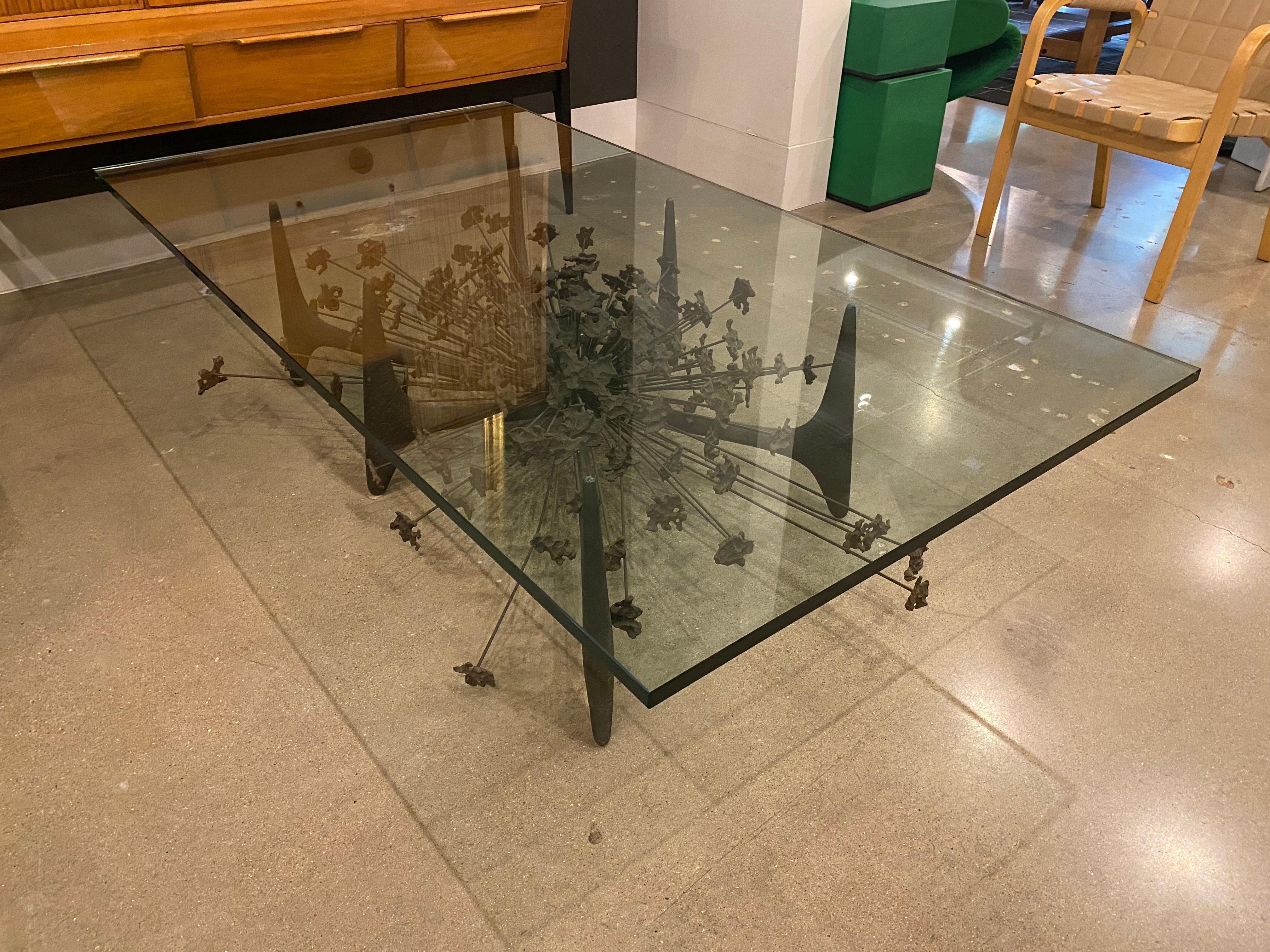 Abstract cocktail table in steel and bronze, designed by California artist, Daniel Gluck, and crafted by Daniel Gluck Studio. Classic example of Brutalist design from the 1970's. Size reflects existing glass top, but glass can be replaced with a