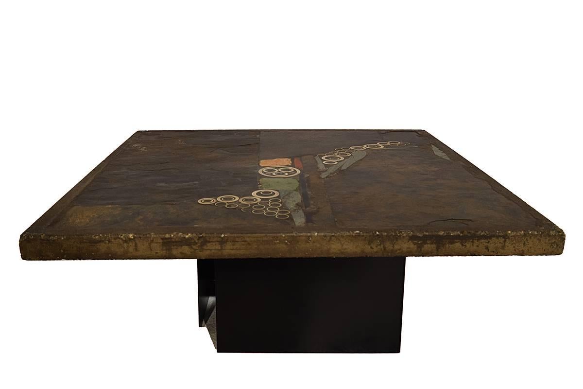 Exceptional Brutalist square coffee or cocktail table, handmade and designed by the late Dutch artist Paul Kingma in the 1970s. Every table is a one of a kind piece. Paul Kingma used a variety of materials that he collected throughout his life and