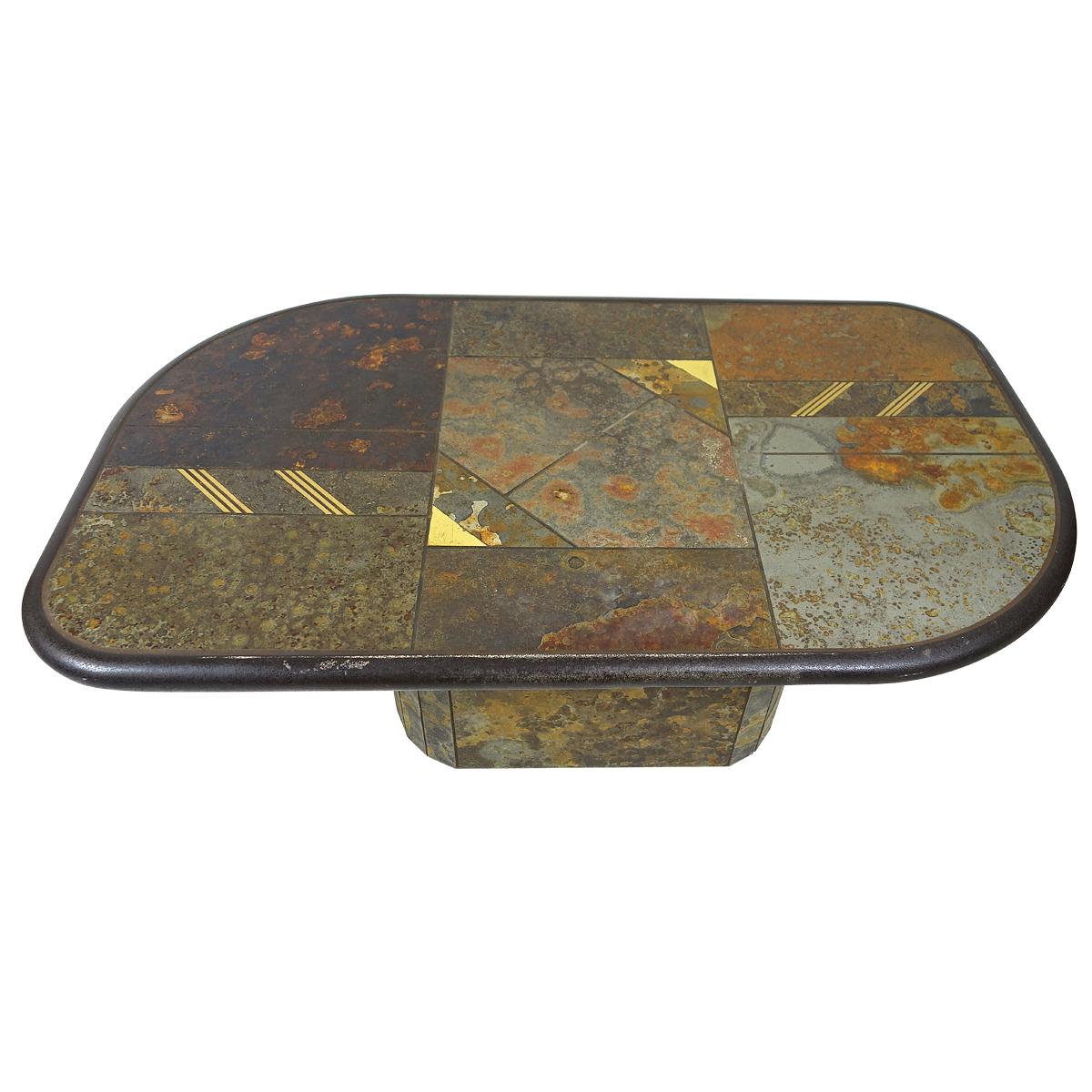 This asymmetrically shaped unsigned coffee table is attributed to Paul Kingma, a Dutch sculptor, painter, mosaic artist and drawer. 
This piece is very heavy, forming a rock solid statement piece in your drawing room. It is composed of all kind