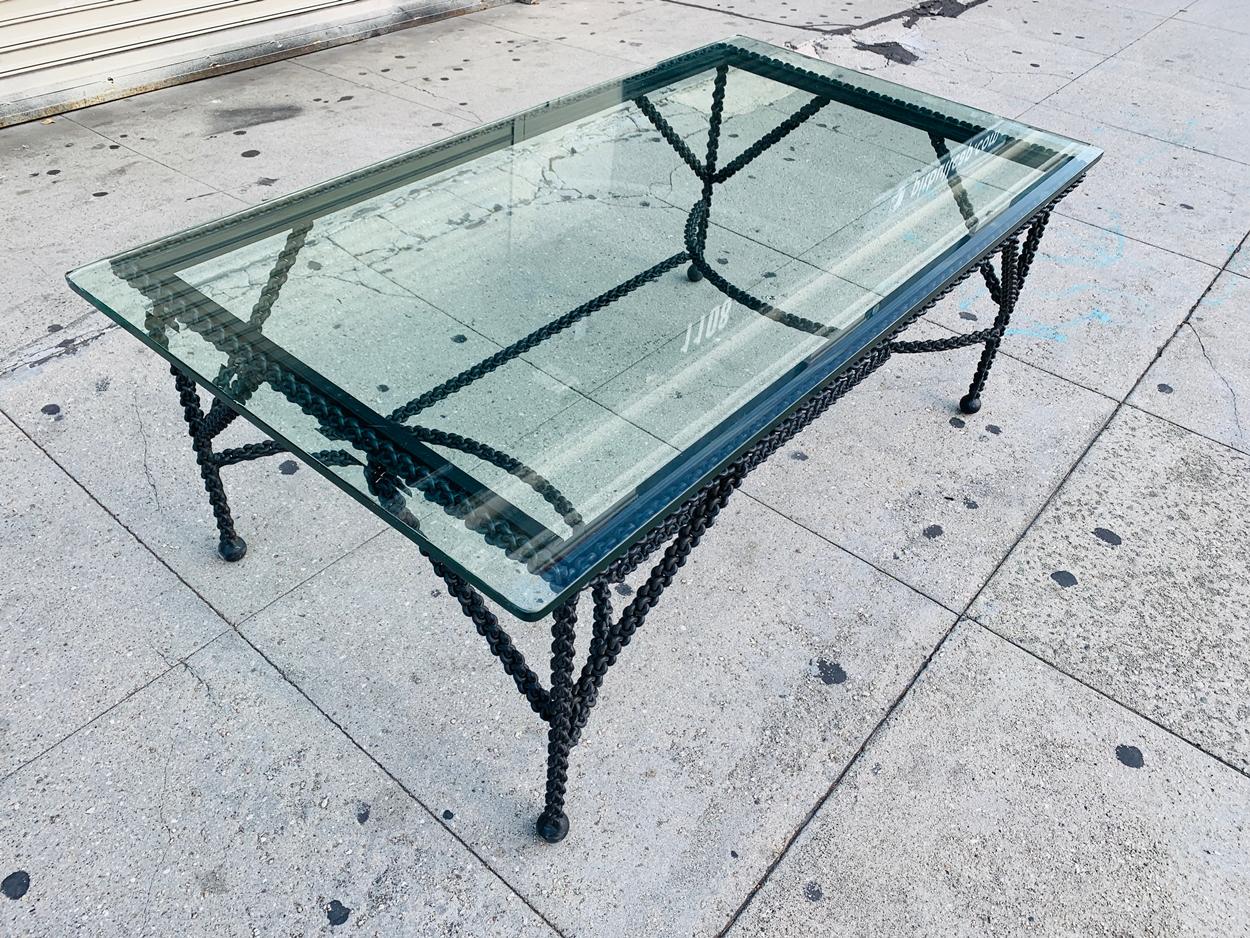 Beautiful coffee table base titled Chains on Me, the table is more like a sculpture, the chains are welded together creating a very intrinsic and modern design.

No glass included.

Measurements:
50 inches wide x 30 inches deep x 20 inches high