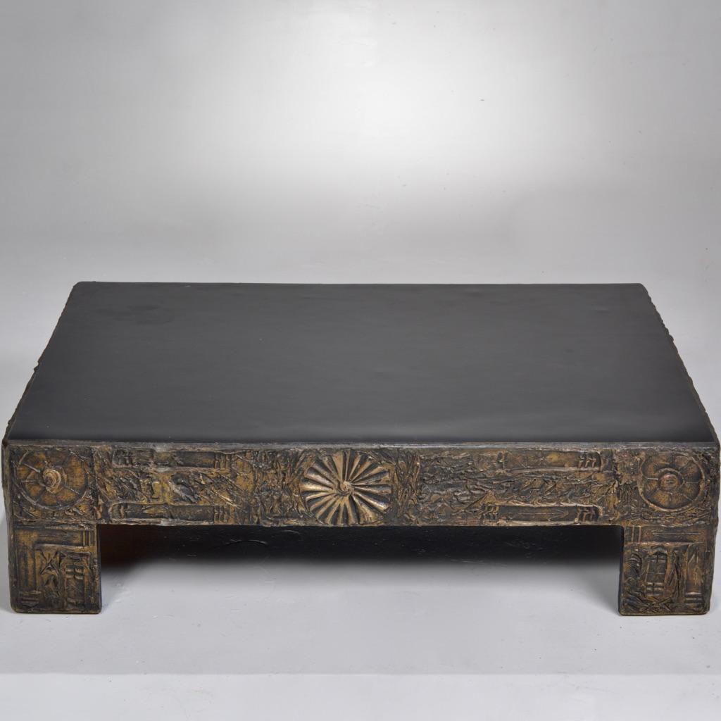 An homage to Paul Evans' sculpted bronze series, this Brutalist coffee table designed by Adrian Pearsall features a black laminate top and nature motifs in a sculpted bronze and black resin.