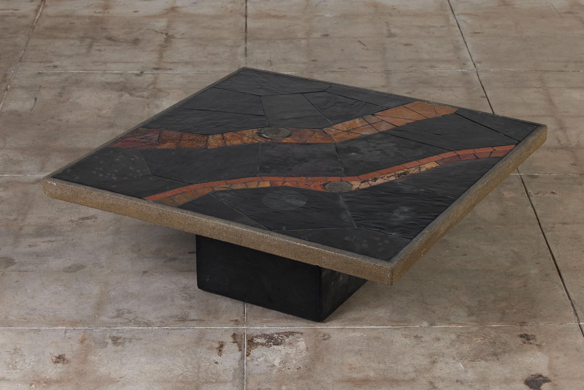 This brutalist coffee table by Paul Kingma, c.1980s, Netherlands, is truly one of a kind. Kingma's designs were often inspired by natural stone elements. Each of his carefully crafted, one of a kind designs, encapsulated his love for mosaic art and