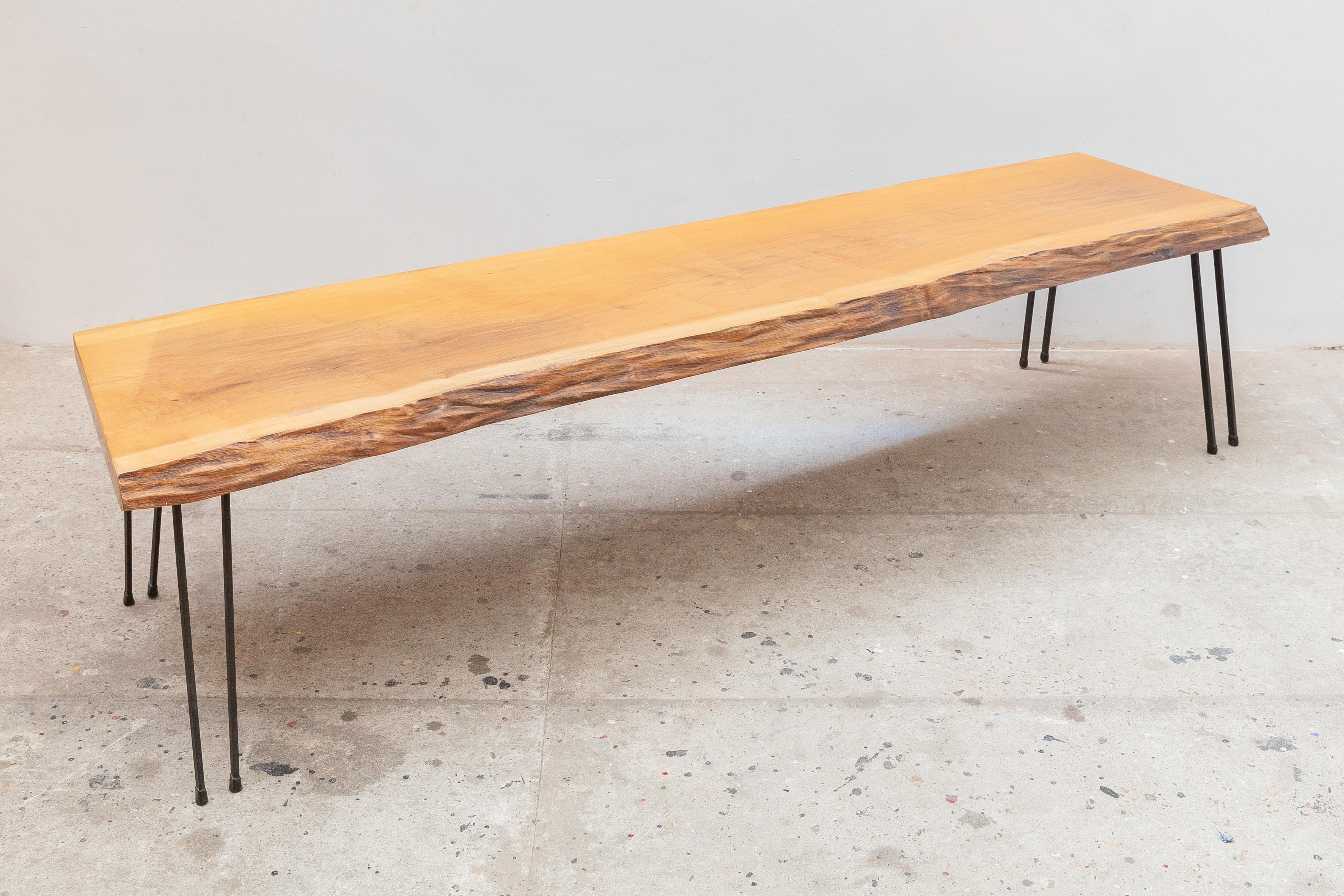 Mid-Century Modern solid slab coffee table or Bench on 8 forged legs in the Style of George Nakashima 1960s. Beautiful part of a tree trunk rudimentary and great as decoration in a sustainable eco modern interior.
