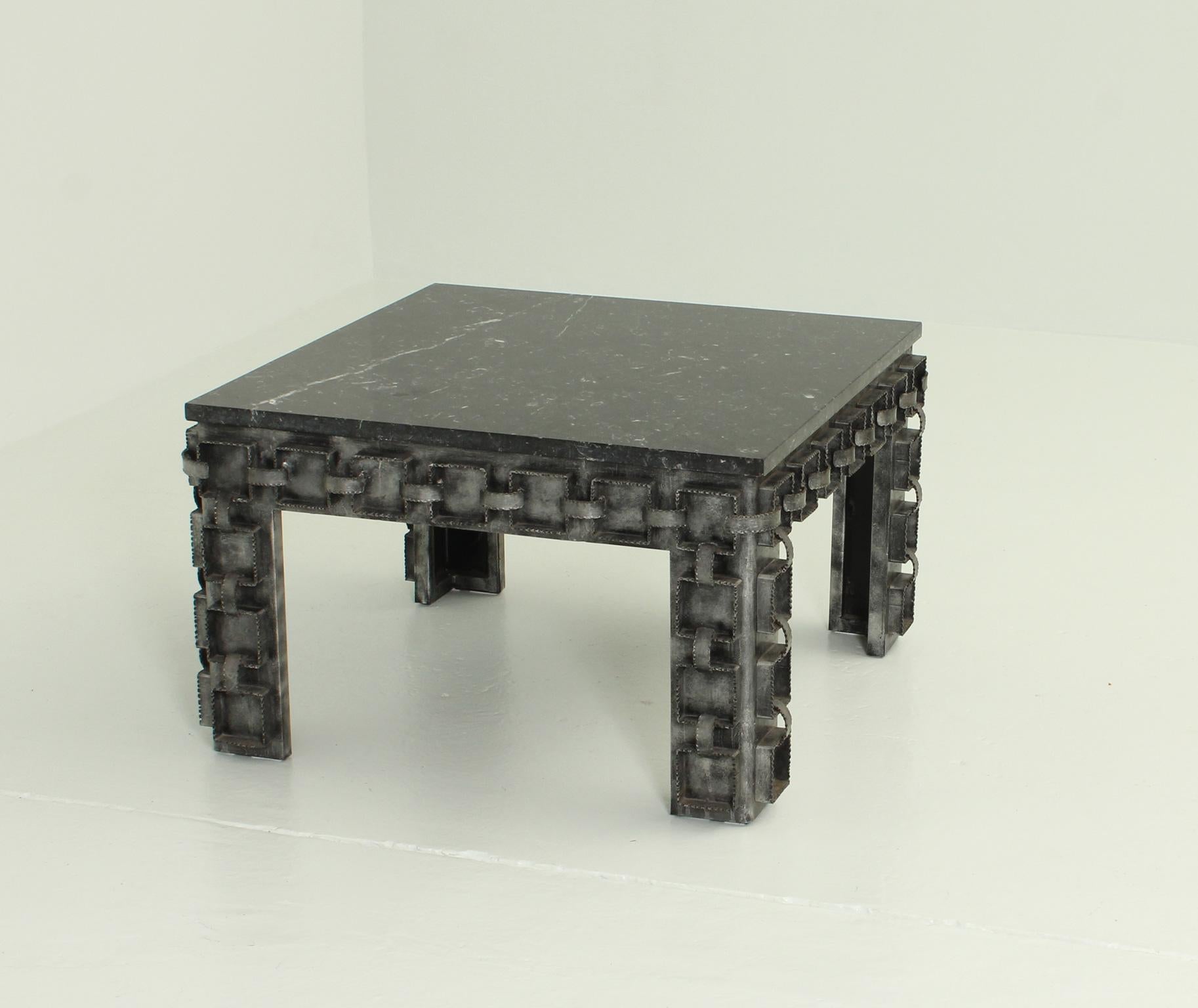 Brutalist coffee table from 1960's, Spain. Singular work in forget and patinated metal and black Marquina marble.
