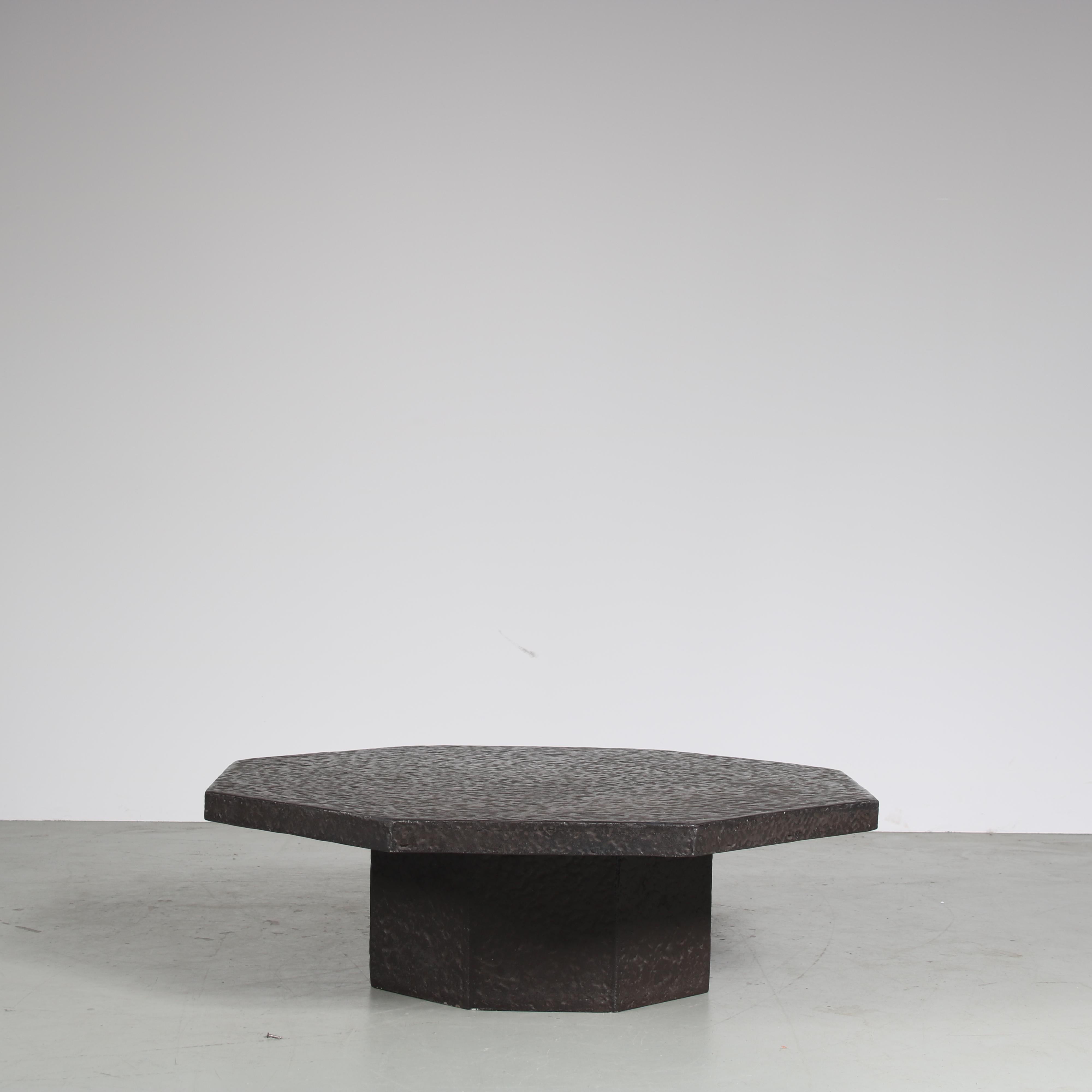 A unique coffee table, manufactured in the Netherlands around 1970.

This brutalist style piece has a strong appearance with octogan shaped top and a sturdy look. It is made of high quality resin in a stone look. A very nice use of materials that