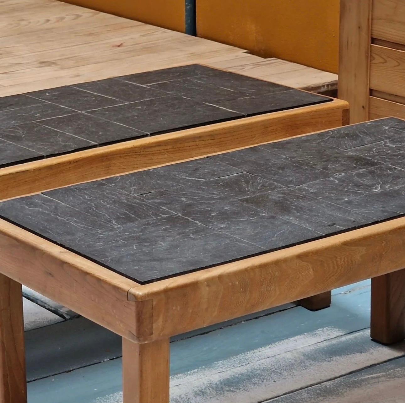 A pair of coffee table in elm and slate could be separate if necessary