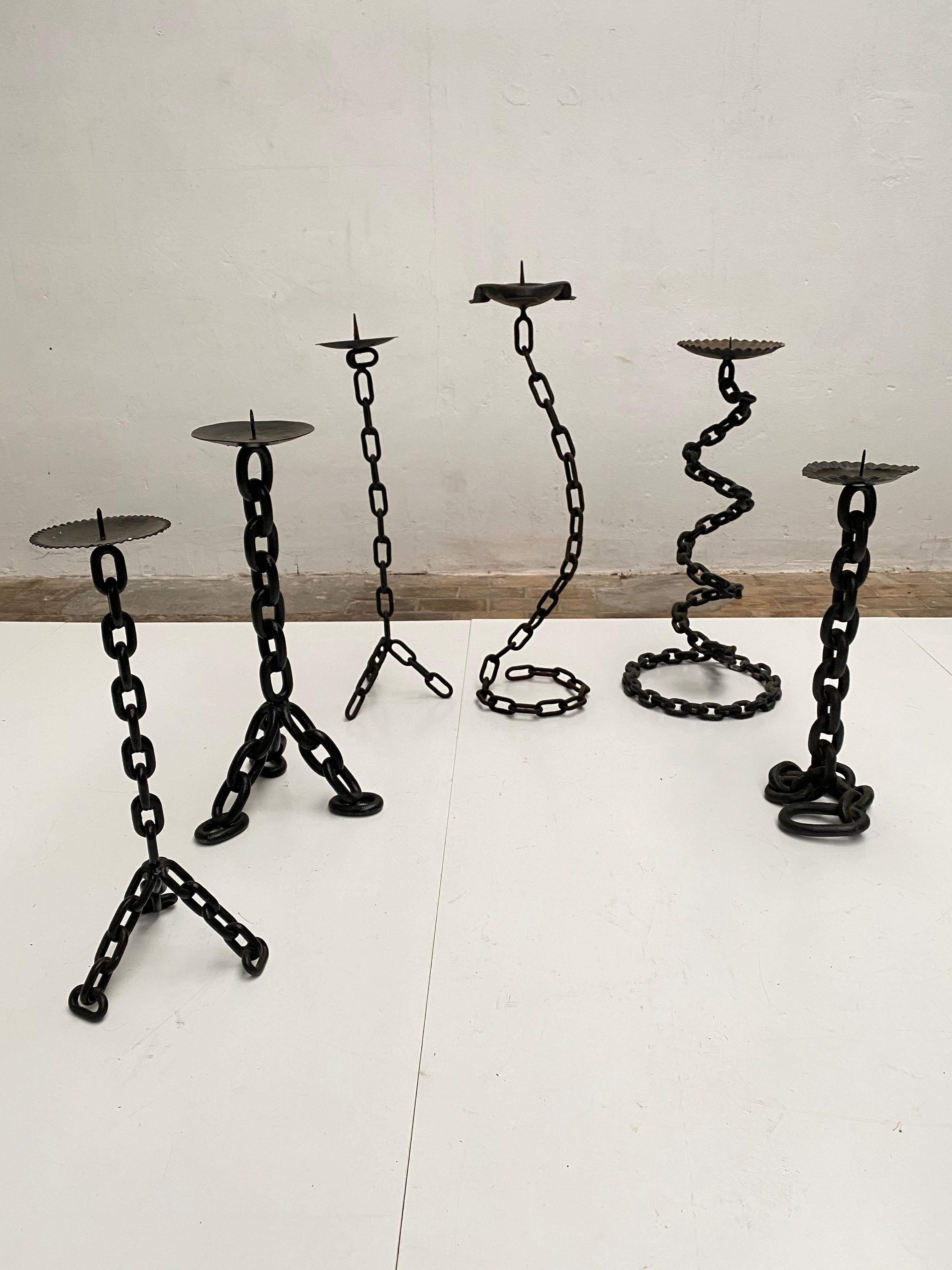 A collection of 6 impressive sized brutalist 1970s candleholders

Iron chains and wrought iron has been welded and forged by hand to make these brutalist forms 

The origin is from The Netherlands where in the 1970s this brutalist style was in