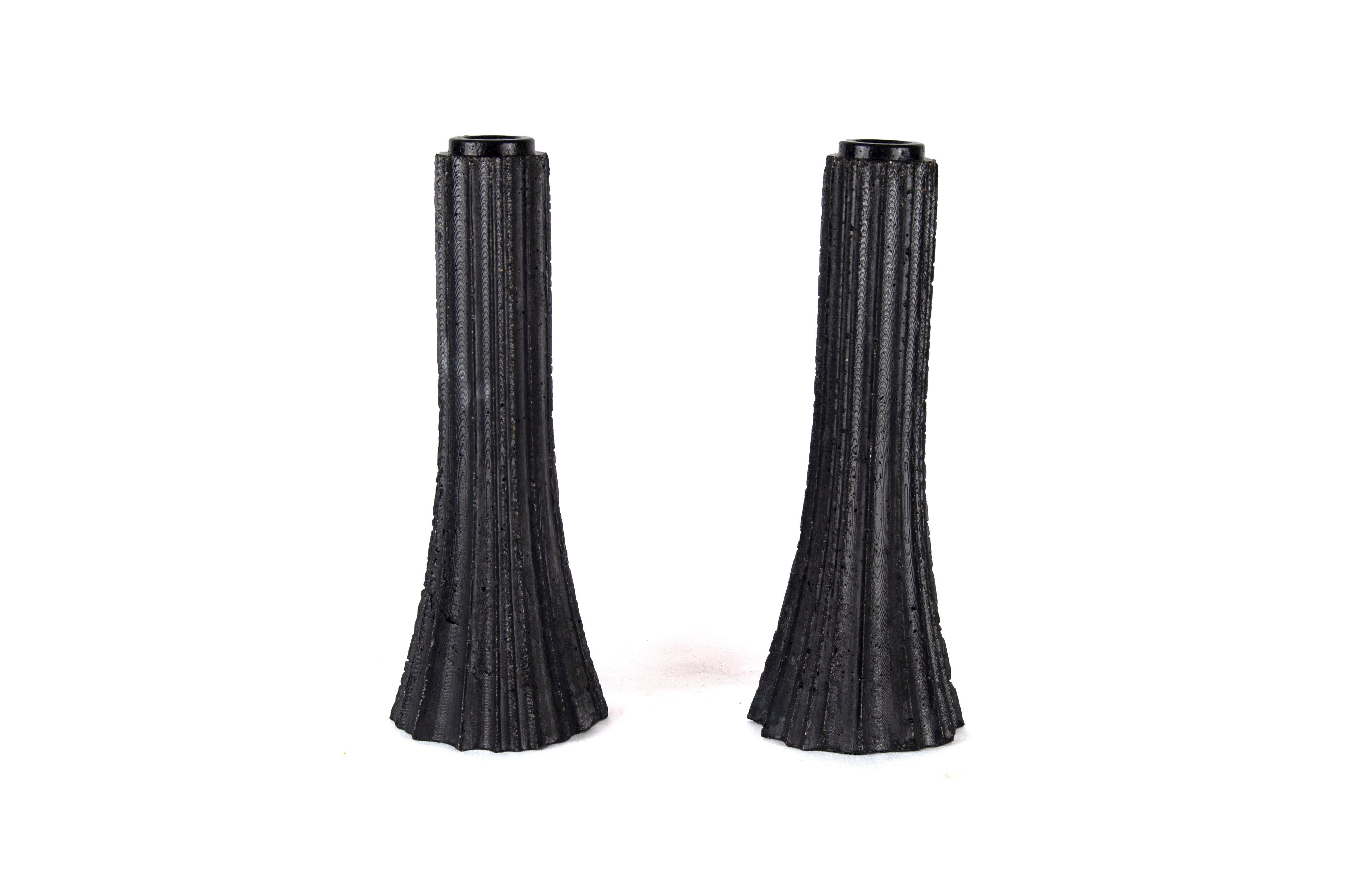 These gorgeous candlesticks were inspired by vintage Soviet rockets. 

Cast concrete with a dark gray pigment, gloss finish. Candles not included. 

Small batches, with limited quantities available. 

Chris has recently shifted from making